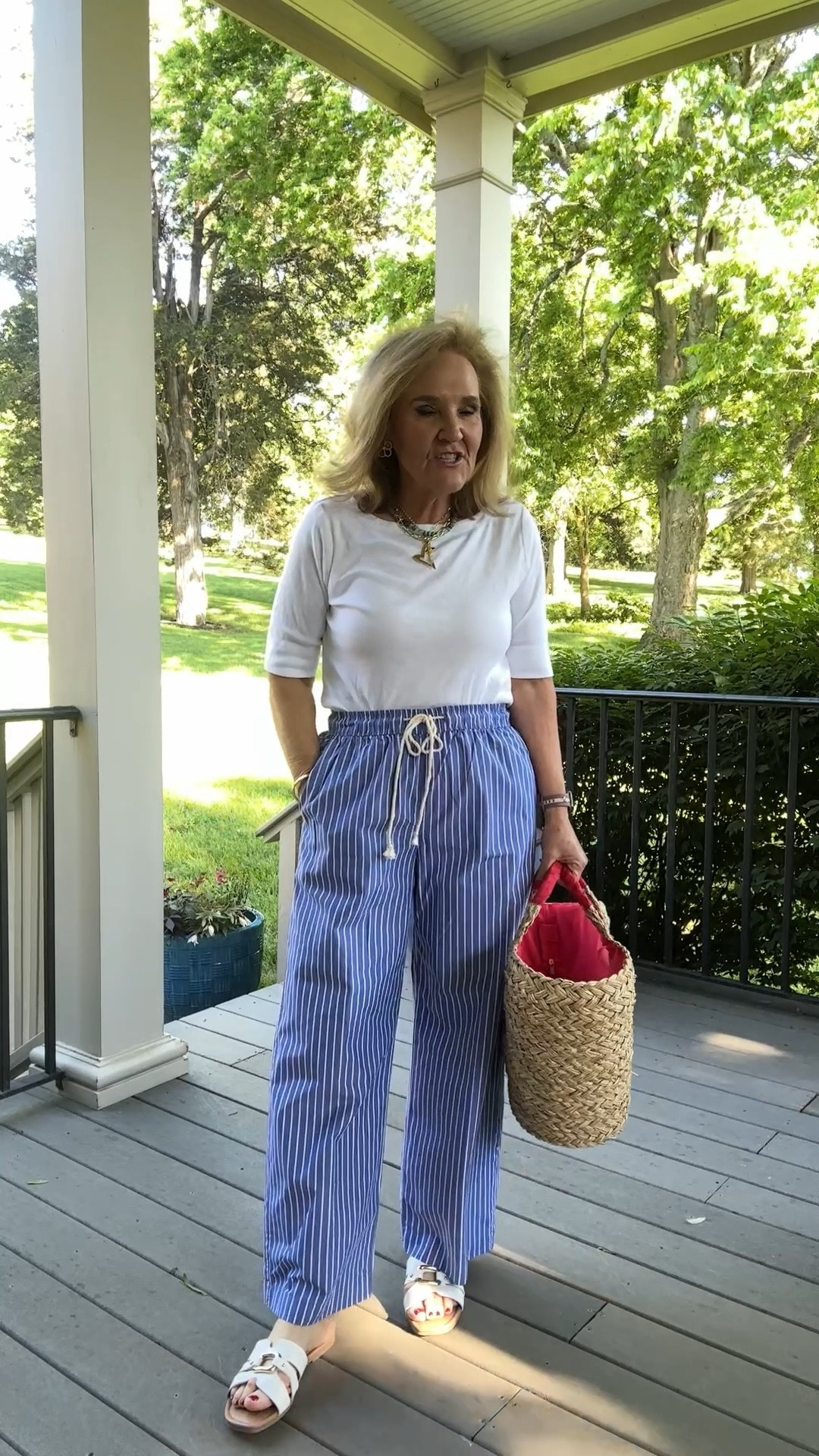 I am loving these striped cotton, Poplin  pants. Wearing size medium.
T-shirt is by Chico’s. I love the boat neck. Size 1.0
And this large tote bag is so pretty it makes such a statement and quite functional. It’s a lot in here would be great for a beach bag a picnic bag or a road trip. Use my code NANETTE15 for 15% off the bag at shop Avara 

My sandals eyes size down half size . I’m wearing a nine I’m usually a 9 1/2. 

#LTKSaleAlert #LTKOver40 #LTKFindsUnder50