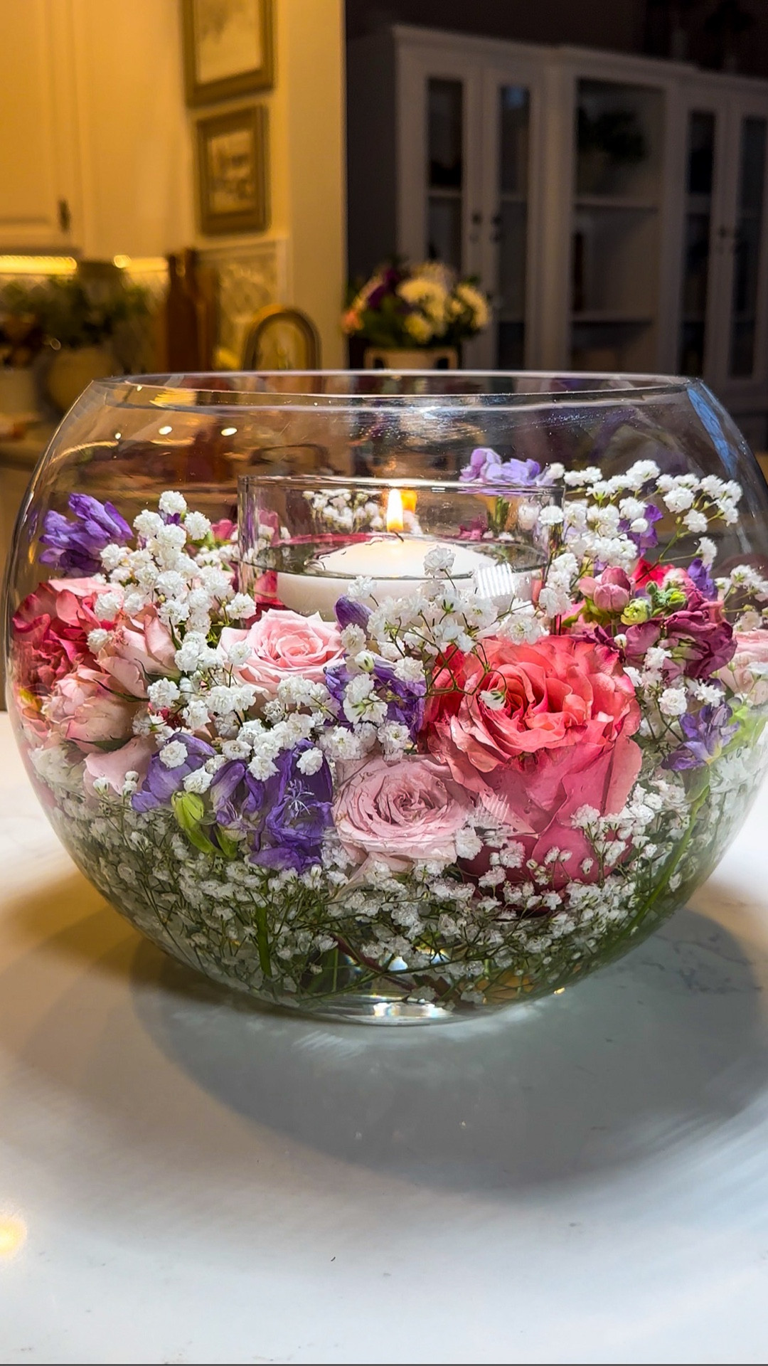 Bubble Glass Vase Centerpiece 🌸✨
I love how this looks like a professionally styled arrangement—but it honestly takes me minutes to make. I just trim and tuck store-bought flowers into a bubble glass vase and add a floating candle for that soft, beautiful glow.

It’s simple, effortless, and instantly makes my table feel polished and special.

Perfect for Mother’s Day, showers, or any spring gathering.

#LTKSeasonal #LTKMothersDay #LTKHome