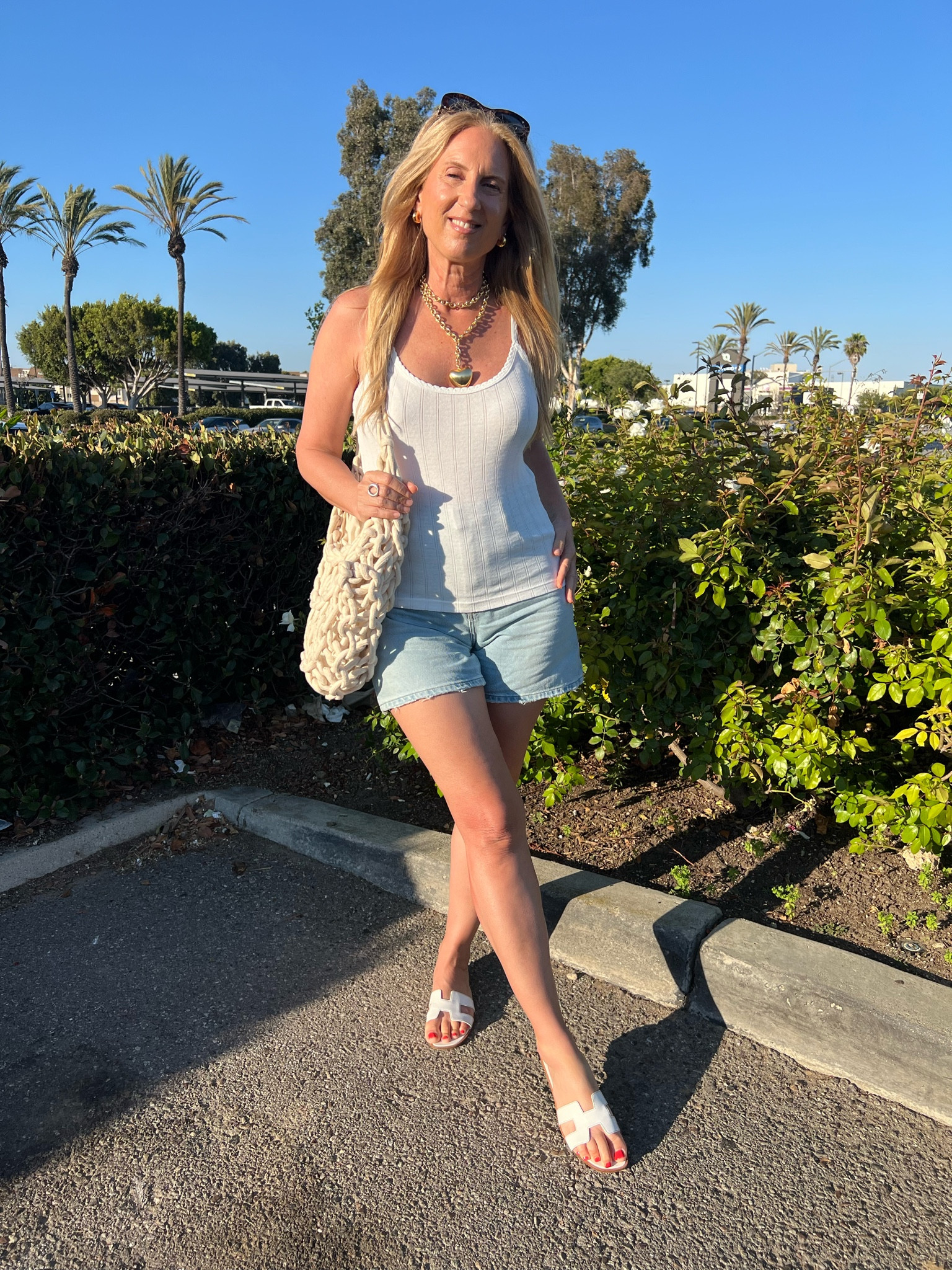 It’s officially beach season! I love wearing  denim shorts that hit at just the right spot to make my legs look longer. I saw that the upcoming Nordstrom sale is featuring the updated version of these shorts too. 

I am wearing size small in the tank and size 27 in the shorts because I went up a size for a looser fit. Sandals are Hermes so I’m giving a more affordable version.

#LTKStyleTip #LTKxNSale #LTKSeasonal