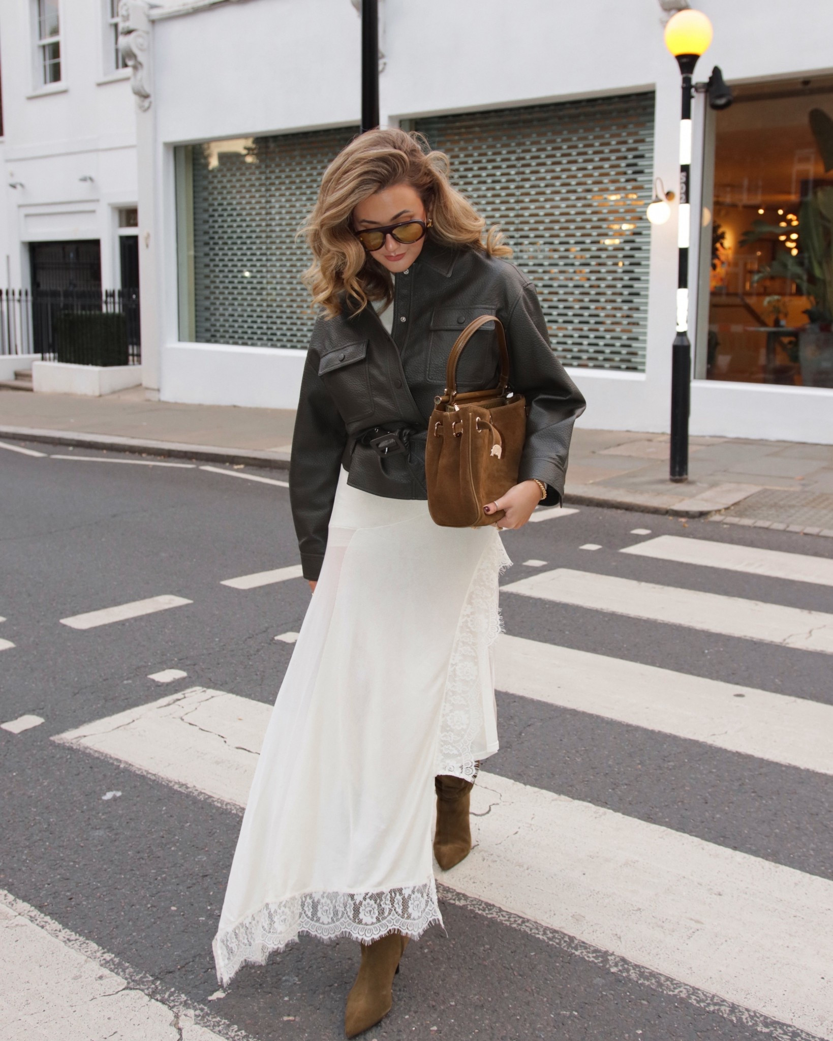 Starting the week with good coffee, great company, and an outfit that feels equal parts comfy and chic.
Wearing a belted leather jacket in deep olive green, paired with a lace trim dress that l've styled as a skirt. Styled with suede knee-high boots in khaki, plus a green suede tote bag to tie everything together. Perfect outfit inspo if you're searching for neutral layering, chic city looks, or how to style a slip skirt for autumn.

#MondayStyle #StreetStyle #FallOutfit #OOTDInspo #SlipSkirtStyle #LeatherJacketOutfit #NeutralOutfits #CityStyle #EverydayChic