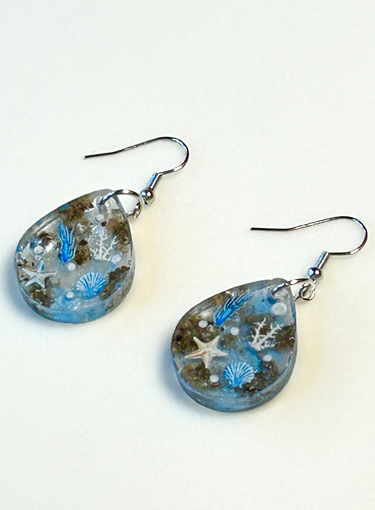 LOVE these beautiful earrings my granddaughter made using UV resin. It was her first time! It captures summer perfectly! So pretty!

#LTKBeauty #LTKStyleTip #LTKSeasonal