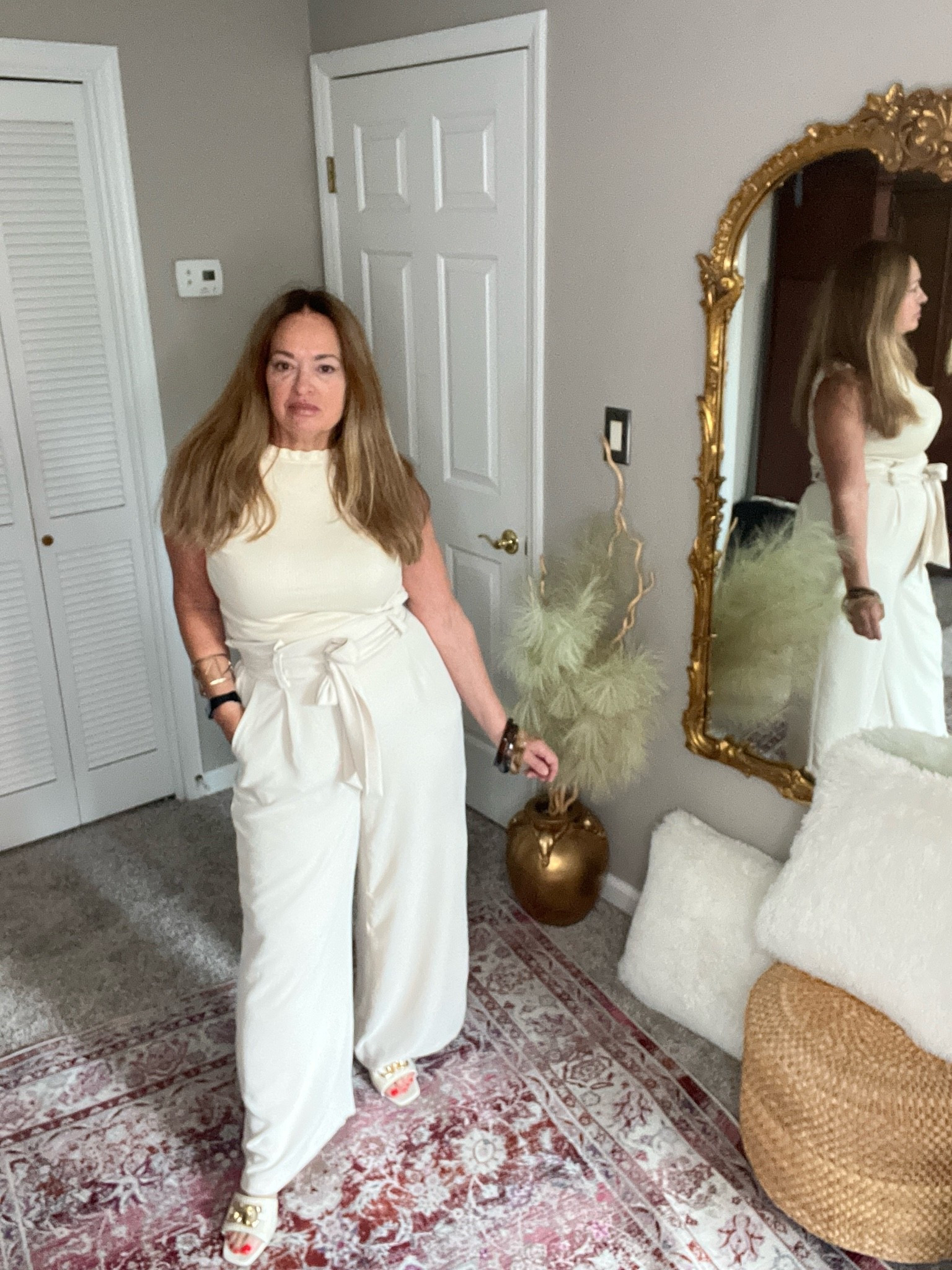 Monochrome ivory column dressing.
High waisted flattering trousers with a ruffled collar tank.

#LTKootd #LTKWorkwear #LTKTravel