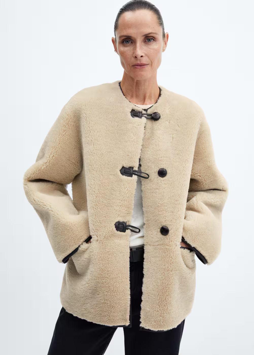 Fur-effect coat with appliqués -  Woman | Mango Canada | Mango Canada
