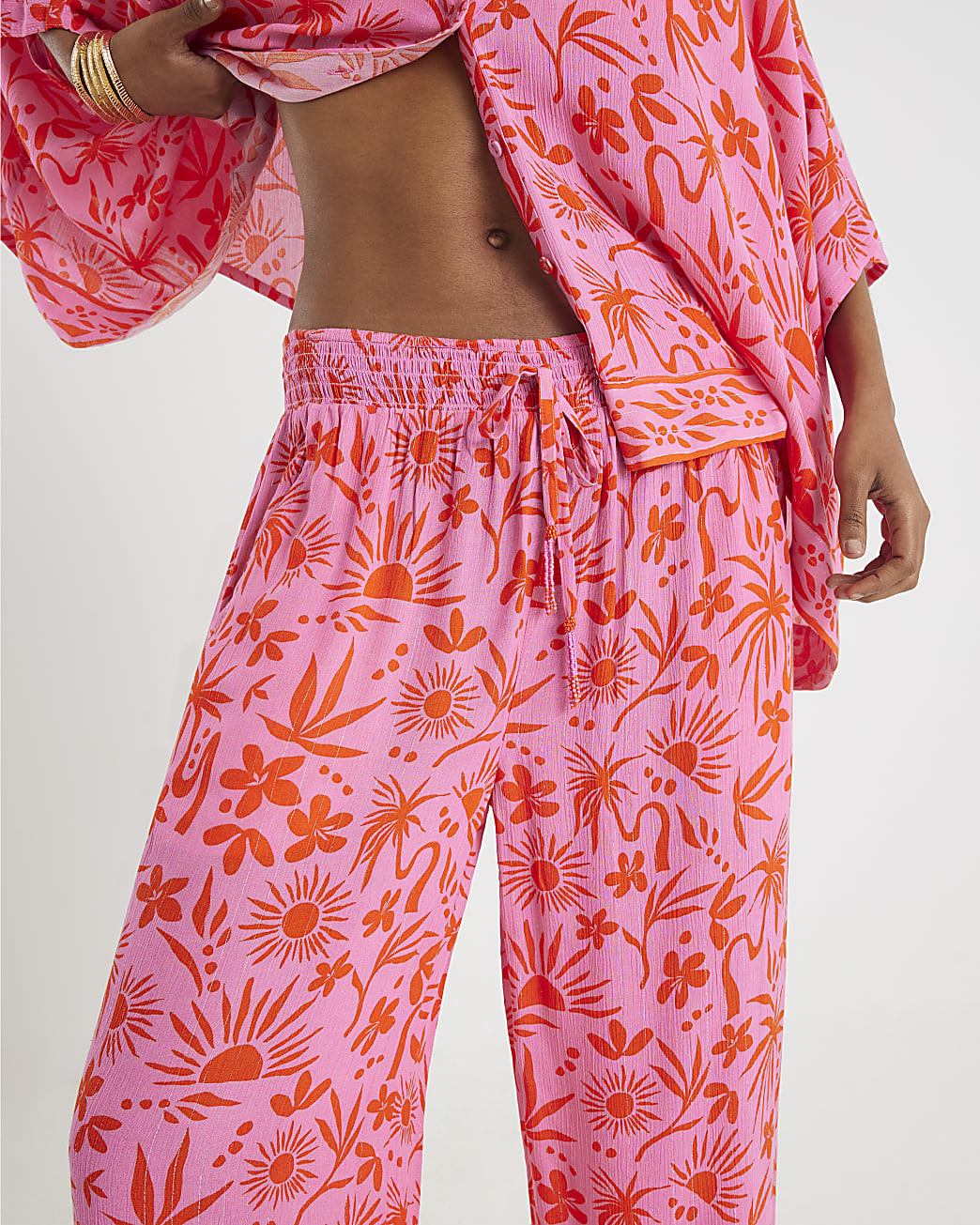 Pink Palm Printed Trousers | River Island UK & IE