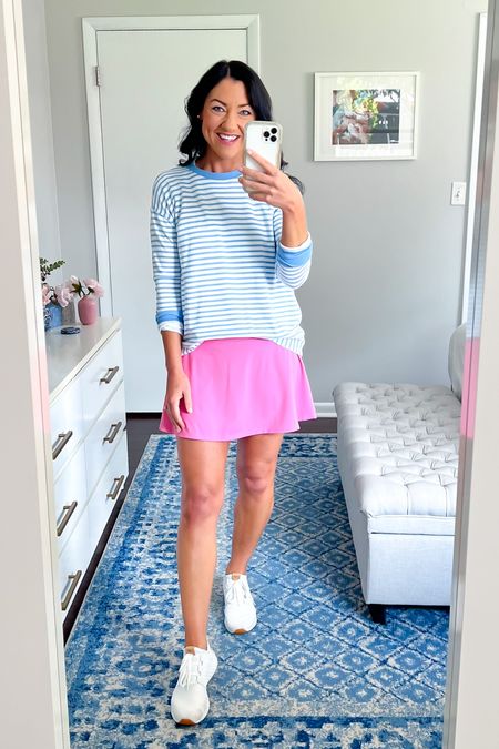 Easy activewear outfit! This blue striped crewneck is hands-down one of the softest pieces of clothing I own! It’s amazing and I wear it all year long! Also available in solid colors, runs big, i sized down to an XS. Love the pop of pink in this tennis skort, only a few sizes left. Fits TTS. Ill link a few others in fall colors as well! And these are my go-to white tennis shoes. I’ve had them for years and they wash up like new! If between sizes I would size up. 

Activewear, mom style, athleisure, tennis skort, pickleball, sweatshirt, fall fashion, casual ootd #momstyle #casual #activewear #ootd 

#LTKunder100 #LTKstyletip #LTKunder50