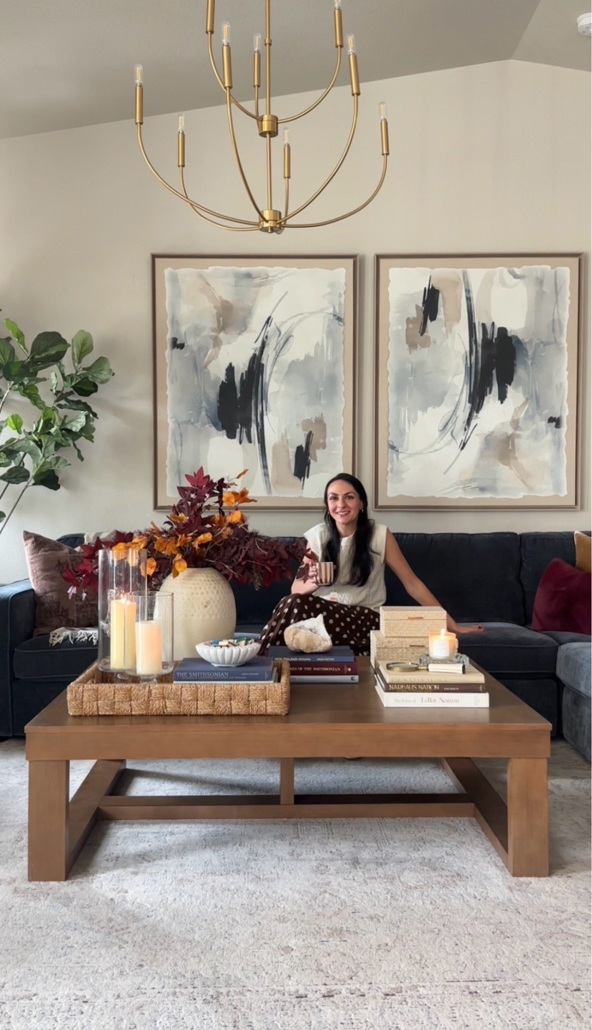 #AD Styling a coffee table can be overwhelming! Here’s my formula for how I styled my @Wayfair  coffee table for fall:
🍁Consider the scale of your accessories. Since this coffee table is so large, I used an oversized vase filled with faux stems. This adds height, creates visual weight, and allows me to add in my red accent color. 
✨Use trays to contain groups of items. Visually your mind groups it all together as one object so it feels less cluttered.
🍂Include a pair of boxes to hide unattractive items like coasters and remotes. 
📚Create height and groupings with stacks of coffee table books.
🪵Add accessories made of natural elements like marble, wood, stone, or glass.
🕯️Use candles for the natural glow that makes a room feel cozy!

I’ve linked my exact coffee table (mine is the “grayish brown” color) and similar accessories so you can easily recreate this look in your own living room! 🧡♥️🤎

#wayfair #wayfairpartner #coffeetable #coffeetabledecor #coffeetablestyling #coffeetableaccessories

#LTKSeasonal #LTKHome #LTKSaleAlert