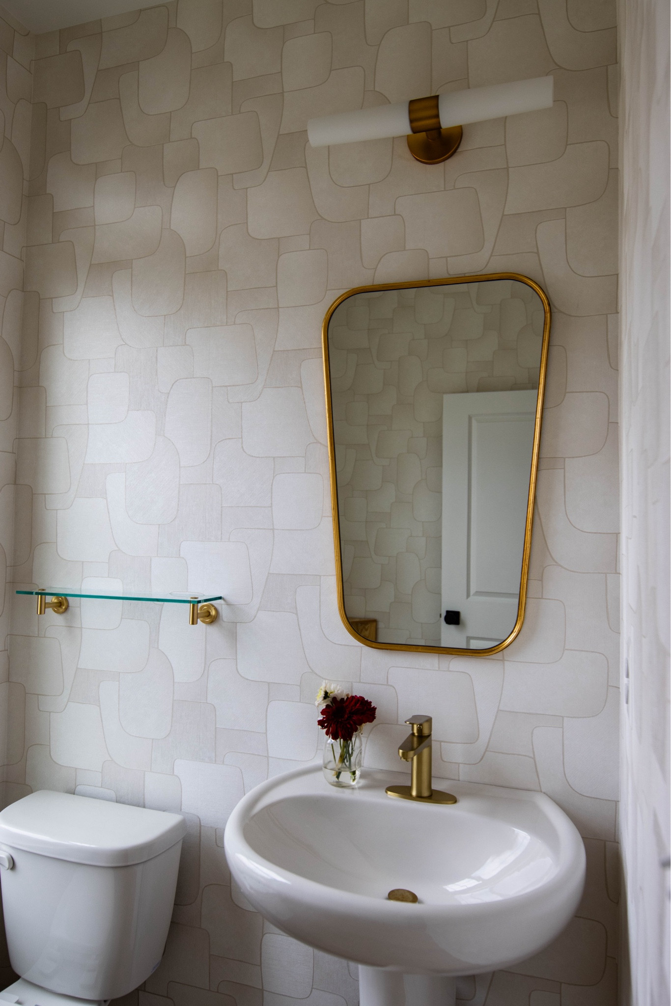 Powder room wallpaper with gold mirror and gold faucet

#LTKhome