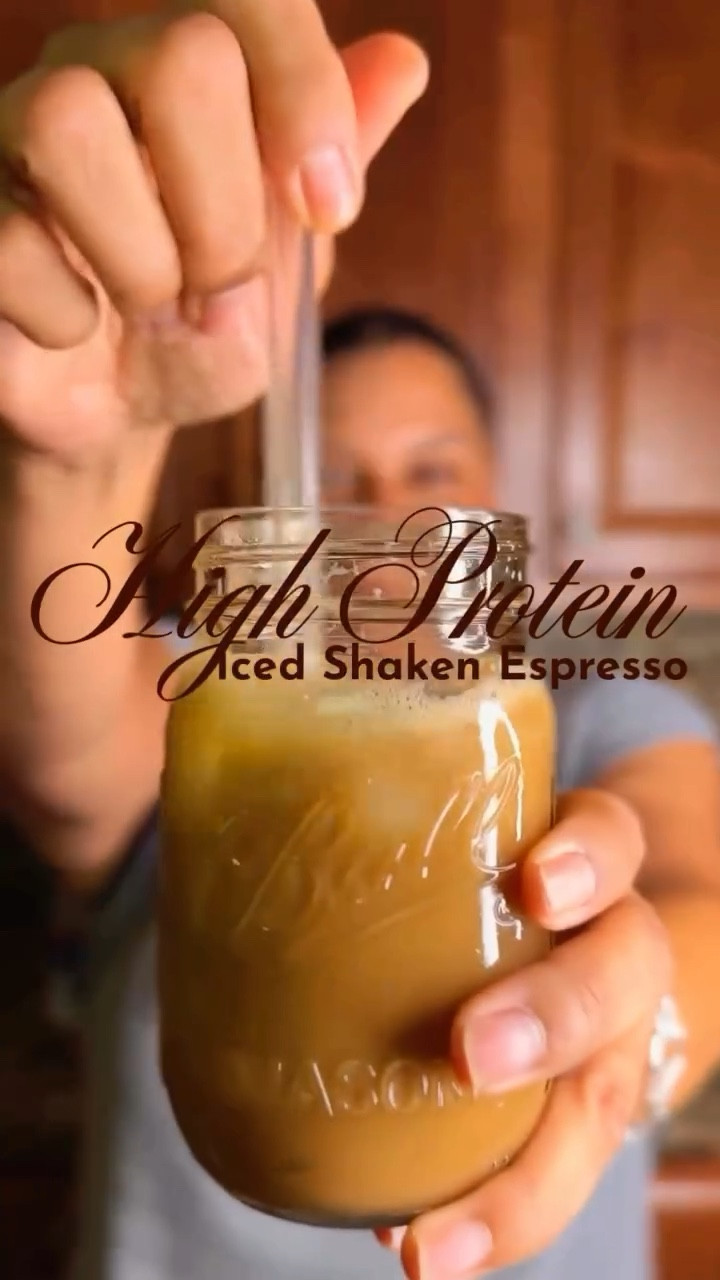 HIGH PROTEIN ICED SHAKEN ESPRESSO // Fun fact: I am always caffeinated. Yes, coffee is my love language. When I go to my fave coffee shop, I usually order a sugar free iced shaken espresso with 1 splenda. Sometimes I get fancy and order it with sugar free vanilla. 

But it’s not a cheap purchase, so I usually make it at home during the week and treat myself at the coffee shop on the weekends. Bonus of making it at home: in addition to saving some coins, I get to personalize it and ramp up my protein…again for free!

Here’s how I make mine:
* In a heat resistant glass, add 2 scoops of collagen protein powder and a packet of Splenda. 
* Pull 3 shots espresso (or 3 tbsp instant coffee in hot water). My faves for my Nespresso Vertuo are Diavolitto (used here) and Altissio.
* Add the hot espresso to the glass and stir until dissolved (I usually use my frother here, but when the batteries give out, a spoon works just fine. Stir like you mean it!)
* Add ice and cover and shake what your mama gave ya (You’ll know it’s ready when you see the froth form. If you’re using a cocktail shaker, you’ll know it’s ready when the outside of the shaker is frosty.)
* Add milk of choice (I used about a cup of almond milk) and add anything else you’d like - I used sugar free salted caramel syrup but cinnamon or vanilla would be great too. 
* Top with more ice and you’ve got a protein rich, sugar free yummy iced shaken espresso

Mine comes in at 19 grams of protein and 1 WW point. Winning!
  #ProteinIcedCoffee #IcedShakenEspresso #CollagenCoffee #CoffeeRecipes #HealthyCoffee #HomemadeStarbucks #CoffeeAddict #HighProteinRecipe #SimplyDeliciousLife #wwmeryl #nespresso
#coffeeoftheday #icedcoffeerecipe #wwcoffee