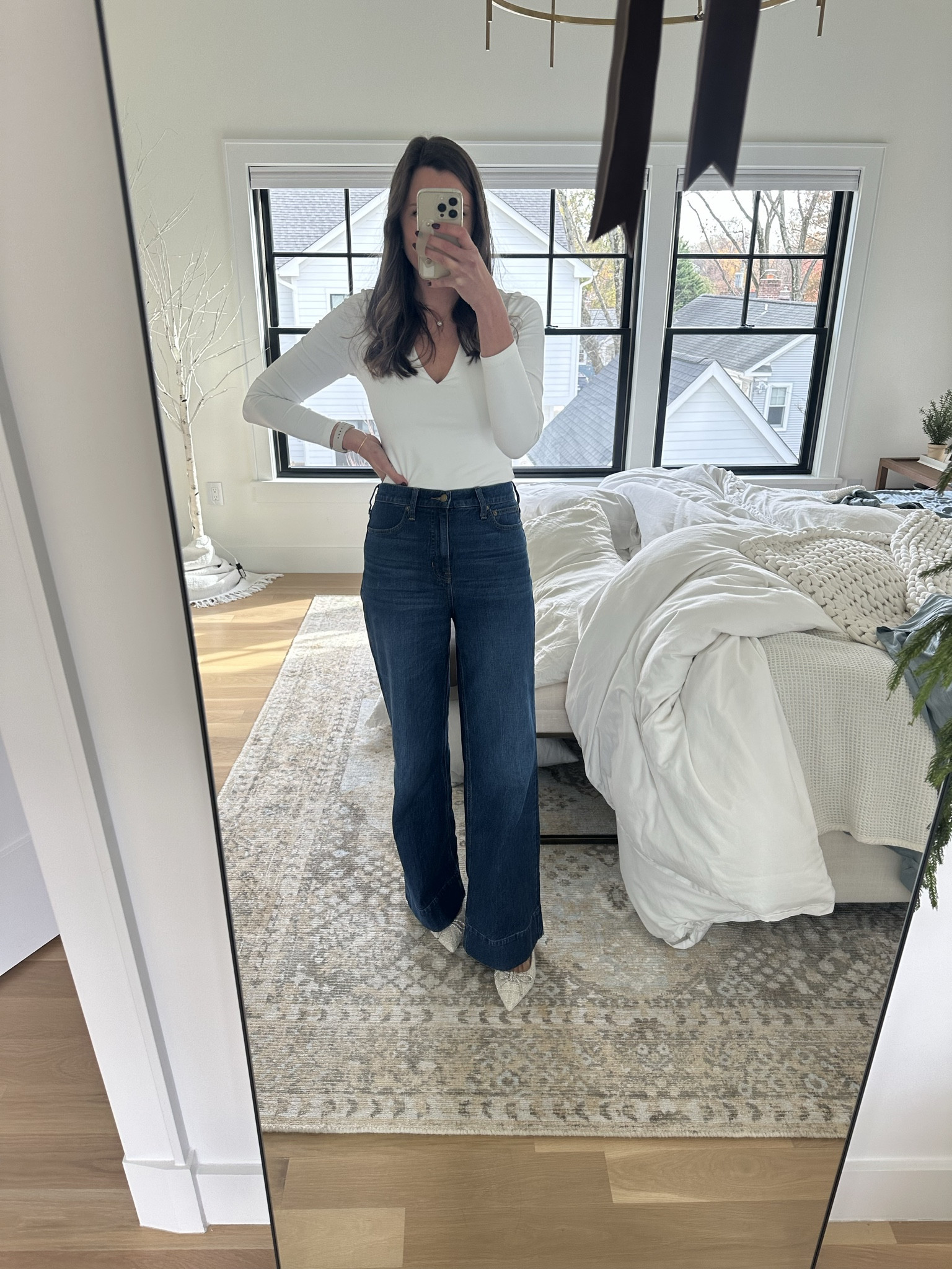 Wide leg, high rise jeans from J Crew, white body suit on sale from Abercrombie, crystal bow flats from Steve Madden. Jeans and flats run TTS

#LTKHoliday #LTKsalealert #LTKCyberWeek