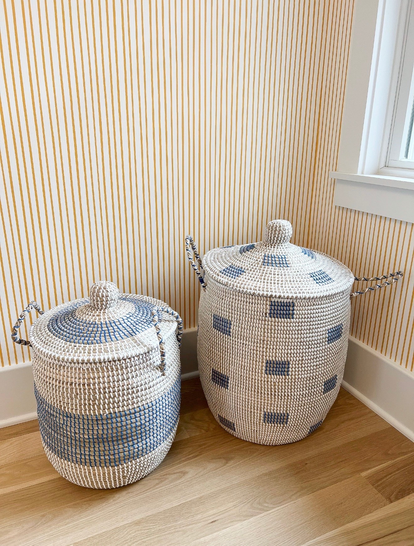 Stripes are one of the easiest patterns to layer with because they can almost act like a neutral. I love how the orange striped wallpaper plays against the blue woven baskets for a mix that feels playful but still pulled together.

pattern mixing, striped wallpaper, woven baskets, orange wallpaper, blue decor, storage baskets, kids room decor, interior styling, home decor, Girl on the Hudson

#LTKHome