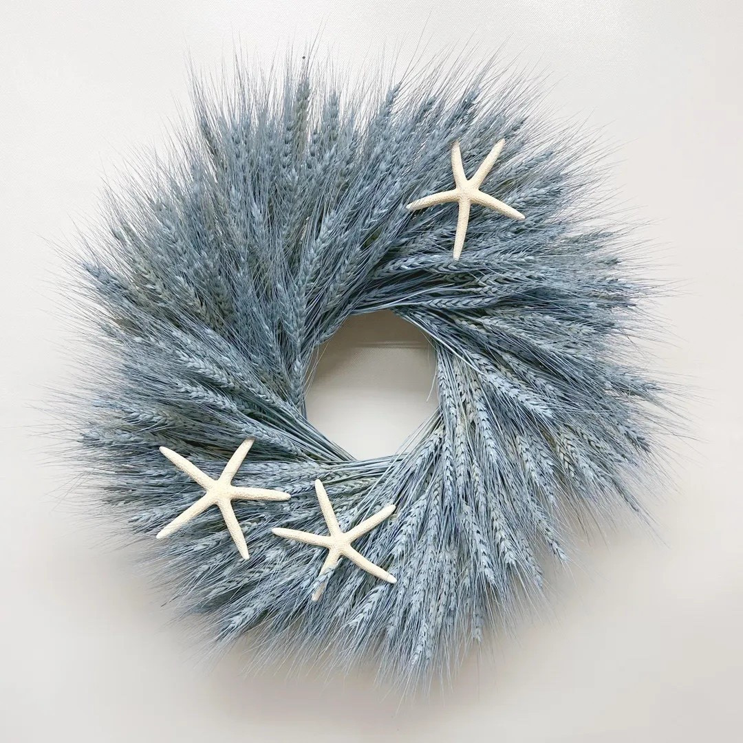 Bring breezy coastal charm into your home with the Blue Coast wreath 🌊 Handcrafted from bundles of air-dried wheat painted in a soft sea-glass blue, this textured wreath feels light, natural, and effortlessly beachy. Three delicate white pencil starfish add the perfect seaside accent, making it a beautiful statement for coastal homes, summer decor, or anyone dreaming of the shore. Each wreath is grown, harvested, dried, and handcrafted on a U.S. farm, making every piece truly unique.

#ltkhome #coastaldecor #beachhouse #wreathdecor #coastalstyle #summerdecor #neutralhome #naturaldriedflowers #homedecorinspo #ltkfinds

#LTKHome #LTKSeasonal #LTKSpringSale