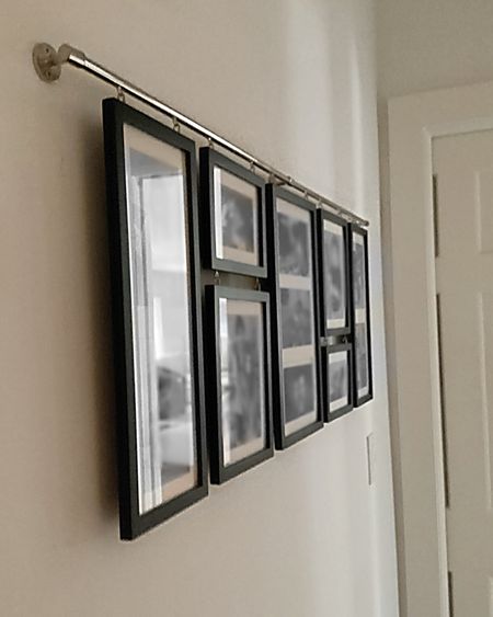 This is a family picture collage wall display that we in our hallway. Ours is matte black with chrome and holds 10 of our favorite photos. It’s also easy to update these over the years. 

#LTKhome #LTKfamily #LTKxPrime