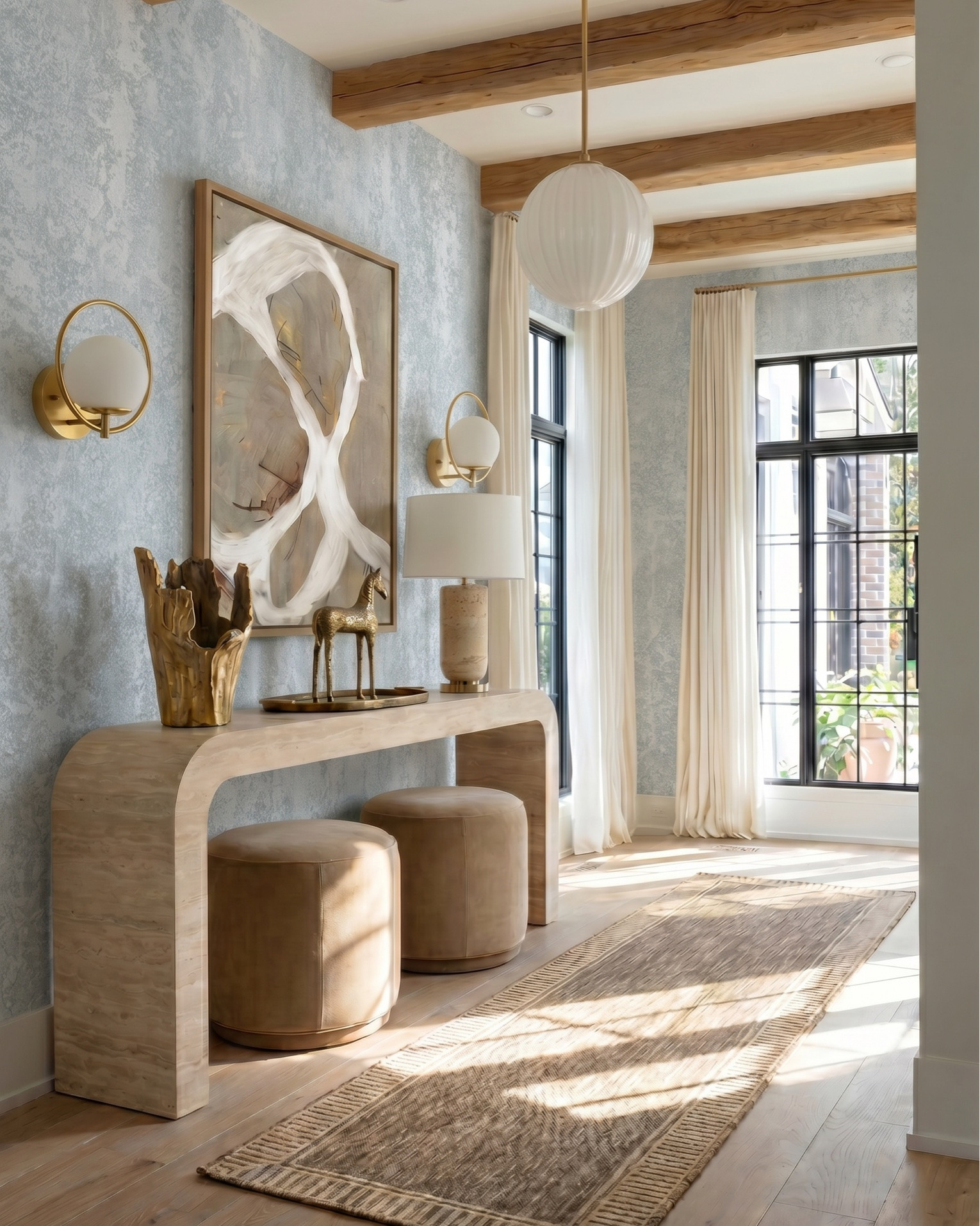 Shop the look:
* White upholstered accent chairs (modern box frame)
* Curved white sofa / loveseat
* Sculptural wood coffee table
* Organic wood side table stools
* Neutral textured area rug
* Marble fireplace surround (warm veining)
* Built-in glass display cabinets
* Light wood console table
* Upholstered round ottomans / stools
* Natural wood ceiling beams
* Light oak hardwood flooring
* Large white globe pendant light
* Fluted white glass pendant chandelier
* Brass wall sconces with globe shades
* Neutral ceramic table lamp
* Modern brass accent lighting
* Abstract neutral wall art
* Oversized framed artwork
* Gold sculptural decor objects
* Decorative brass tray
* Textured ceramic vase
* Organic sculptural vase centerpiece
* Decorative books for styling
* Neutral throw blanket
* Patterned accent pillow
* Small tabletop sculpture accents
* Textured runner rug
* Minimalist console styling
* Soft blue textured wallpaper
* Black framed windows
* Modern built-in shelving decor
* Layered neutral textiles

#LTKsale #LTKhome