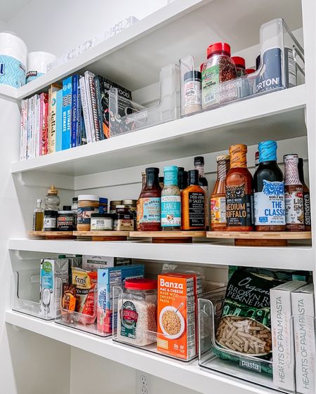 A whole shelf dedicated to wooden turntables for condiments? Yes please! We also love these clear scoop front bins for easily accessible staples that fit perfectly on these shelves. Everyone's pantry is just different enough that it's not just picking cookie cutter products but making sure what is chosen actually works for the space and the family that lives there!

