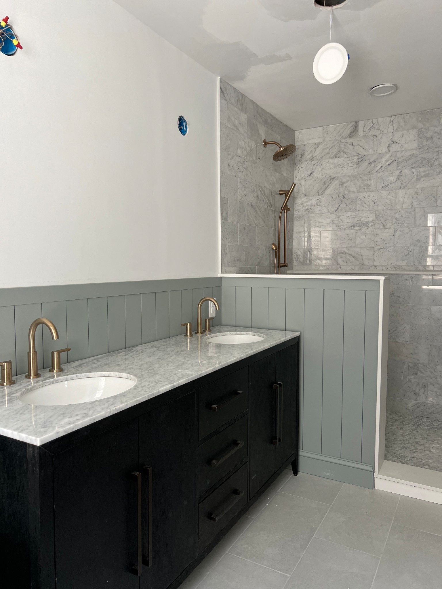 Primary bathroom progress picture with links! Champagne bronze shower fixtures and faucets mixed with marble and black.


#LTKHome