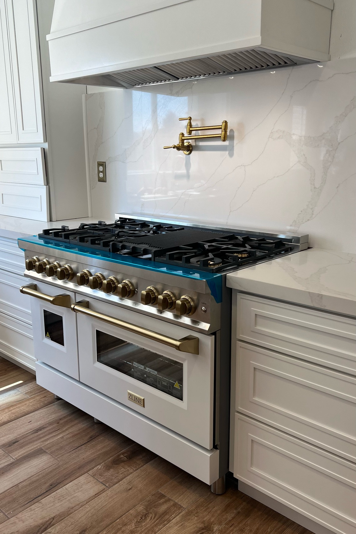 Zline 48inch double oven range in white with champagne bronze accents in the autograph edition. 

#LTKHome