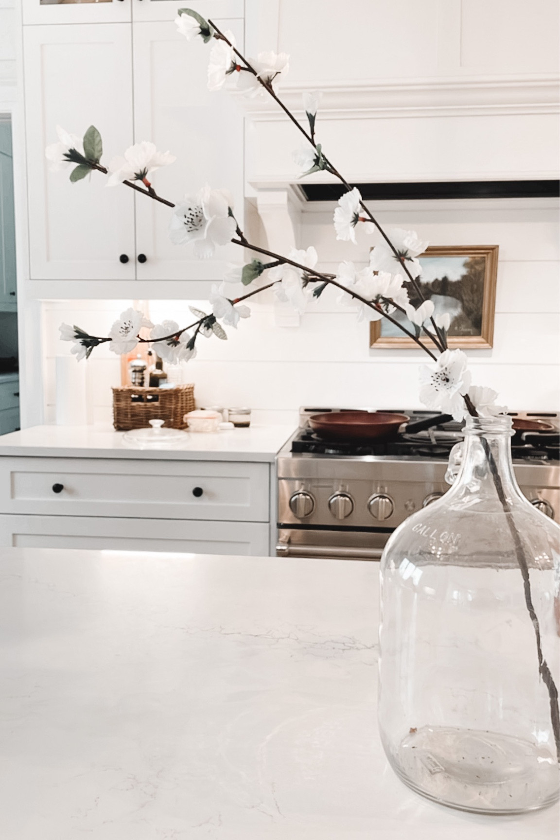 MODERN FARMHOUSE KITCHEN 
.
Add wooden cutting boards, a vintage painting, vintage bottle and flowers! 
.
You’re set! 

#LTKstyletip #LTKhome #LTKFind