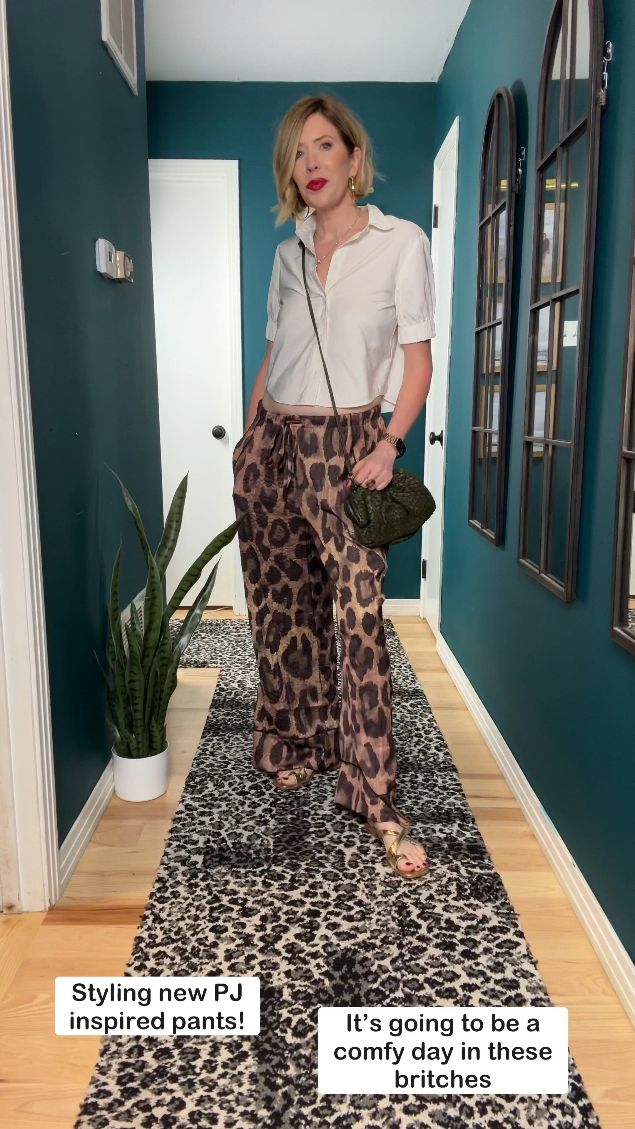 ✨ Who else wants to feel like they’re wearing pajamas while looking chic in leopard? 🐆🙌 These new satin-inspired britches feel just like PJs but come with pockets, a relaxed cropped button-down, and that dreamy sateen texture! Perfect for lounging or stepping out, and I've paired them with gold accents and a gorgeous woven dark green crossbody. 🍂 Ready for now and those early fall vibes! ❤️ Thanks for watching! 
#FallPant #TransitionOutfit  #ComfyOutfit #LeopardVibe

#LTKTravel #LTKOver40 #LTKBacktoSchool
