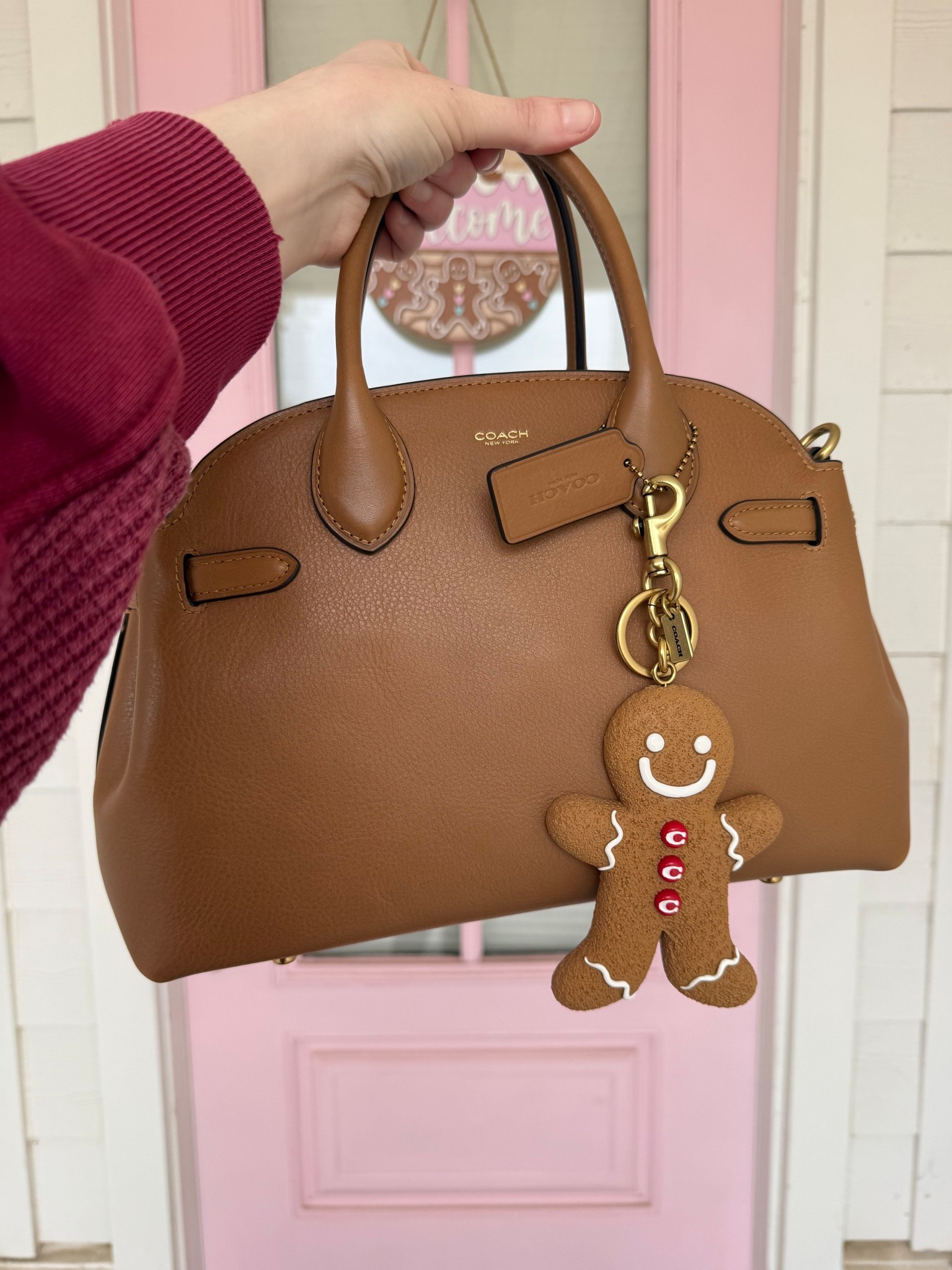 Letting my door reprise its role as my background once again lol. but I had to take this bag outside since the gingerbread matches my door sign! I’ve got it linked here, plus some cute gingerbread bag charms. Sadly this exact one isn’t available to buy but I’ve found some other great
Options! 

#LTKGiftGuide #LTKHoliday #LTKSeasonal