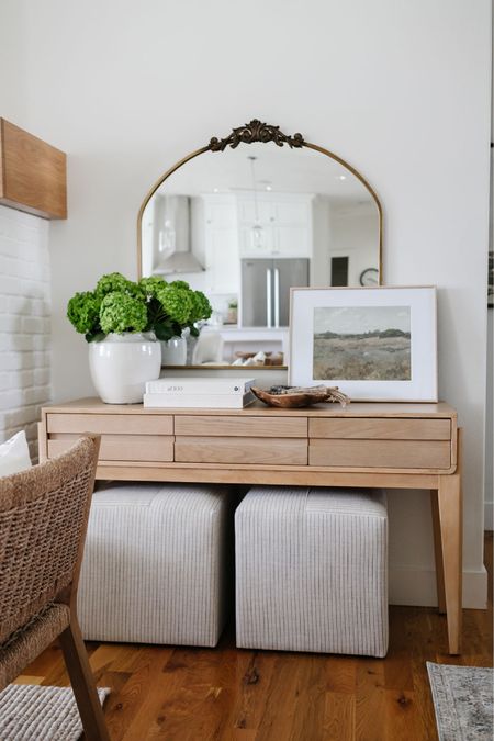 In my living room I have a Studio McGee for Target console table with upholstered square ottomans below it. I love the Lulu & Georgia mirror I have hanging above the table. 

#LTKsalealert #LTKhome #LTKFind