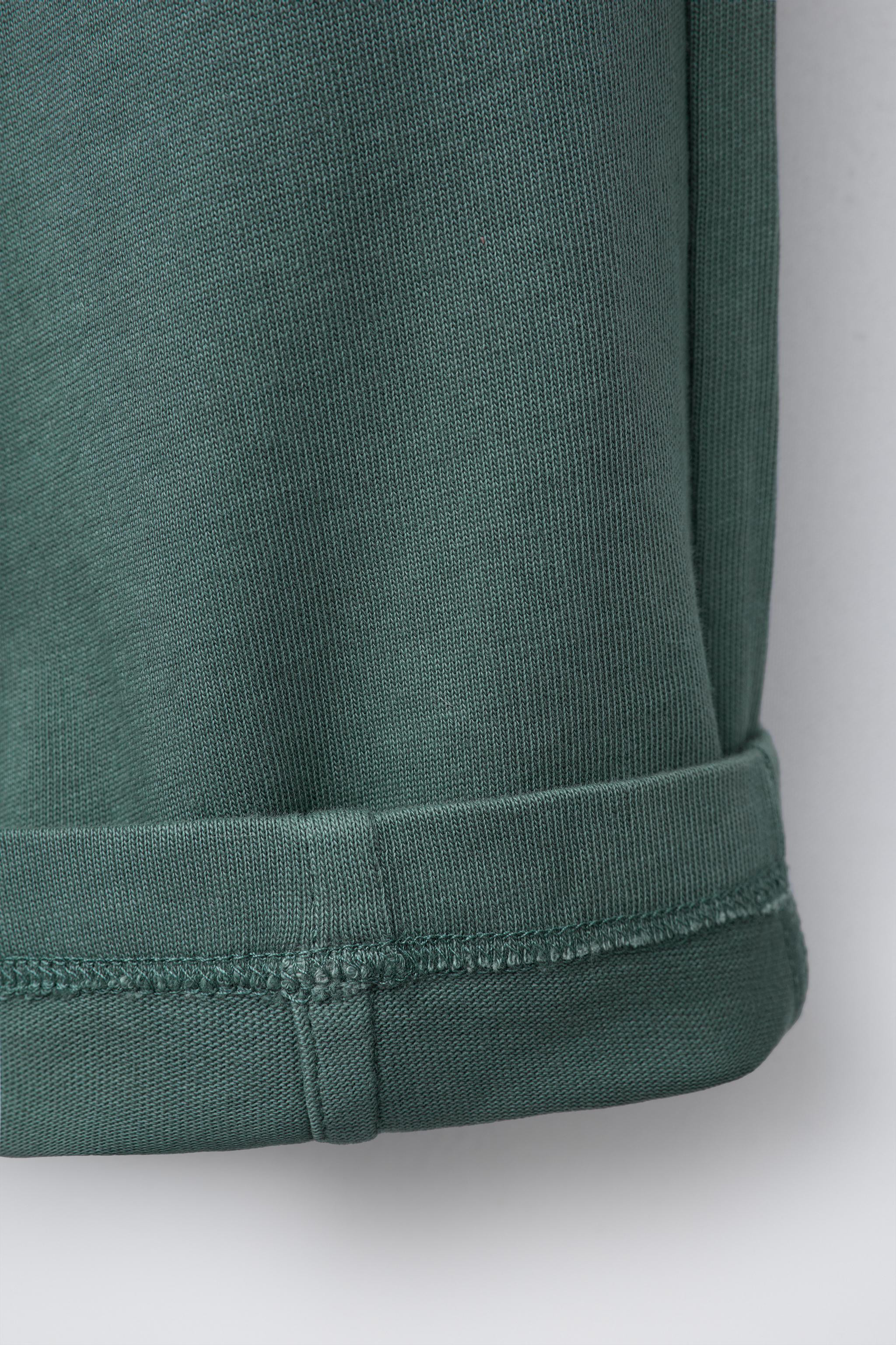 Two-piece set. Round neck, short sleeve T-shirt. Wide-leg trousers with elasticated waistband and... | Zara UK