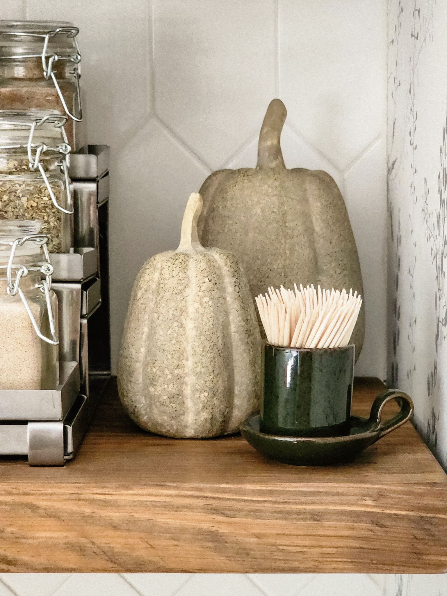 I swapped out my cabbage salt and pepper shakers for ceramic pumpkins and dark olive green candle stick holder I filled with toothpicks to quickly update this space from summer to fall.

#LTKHome #LTKSeasonal #LTKFindsUnder50