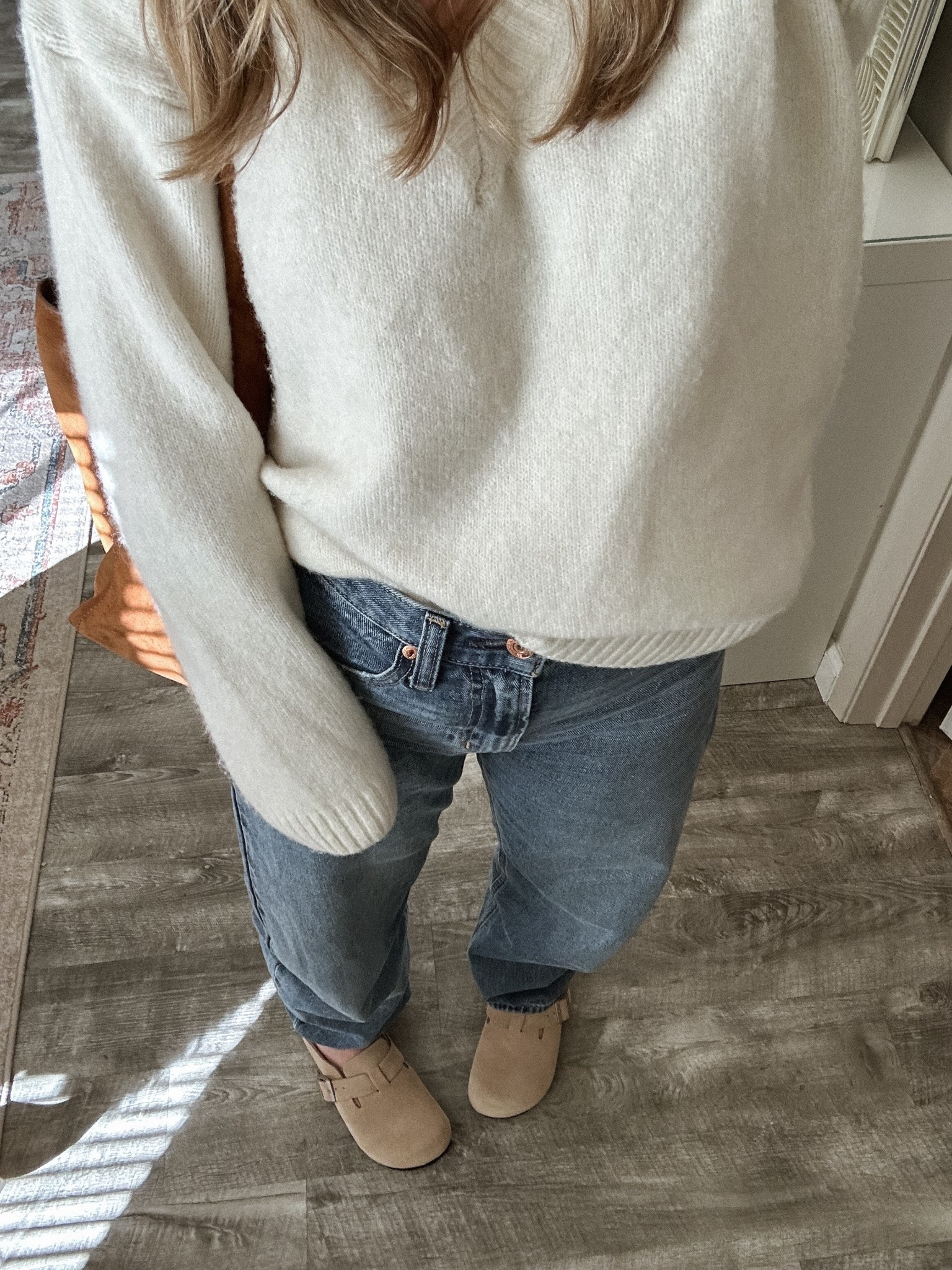 wearing a size small in the sweater and size 26 in the jeans 