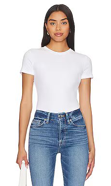 Good American Rib Fitted Tee Bodysuit in White001 from Revolve.com | Revolve Clothing (Global)