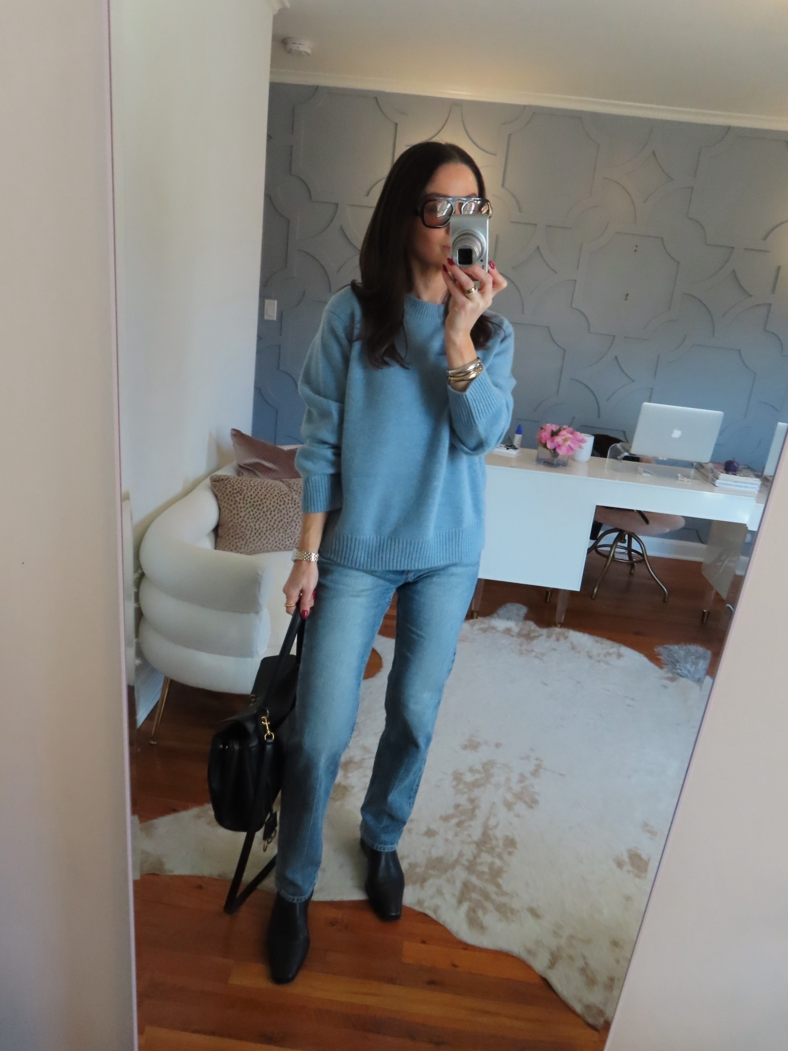 Sweater and jeans true to size. Went up half a size in the boots 