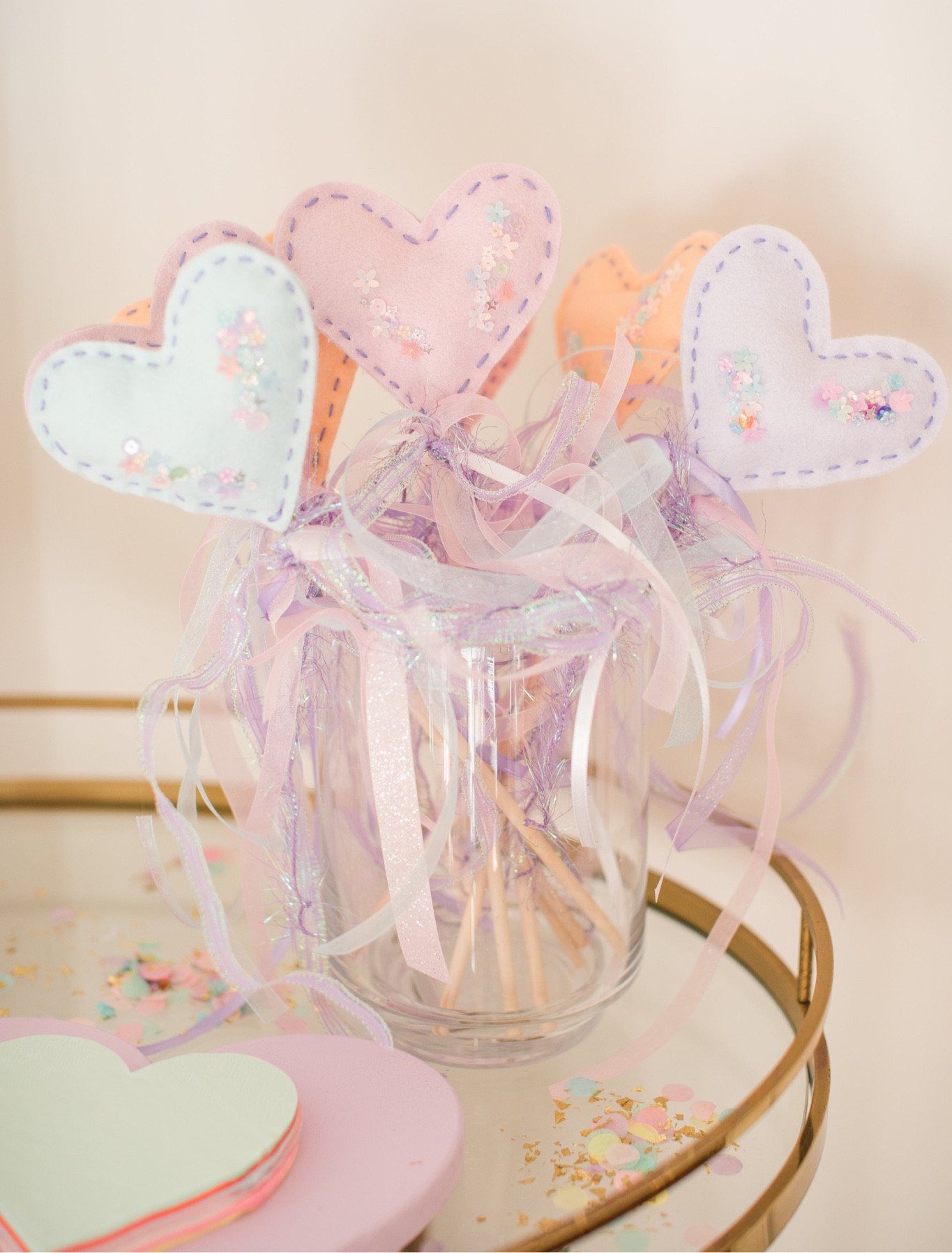 My favorite detail on the party! My mom made these, but linking some of the materials we used to make them! All ribbon was purchased at #hobbylobby! 
#twosweet #birthday #birthdayparty #hearts #candyhearts #tablescape #placesetting #confetti #sprinkles #floral #heartwand  