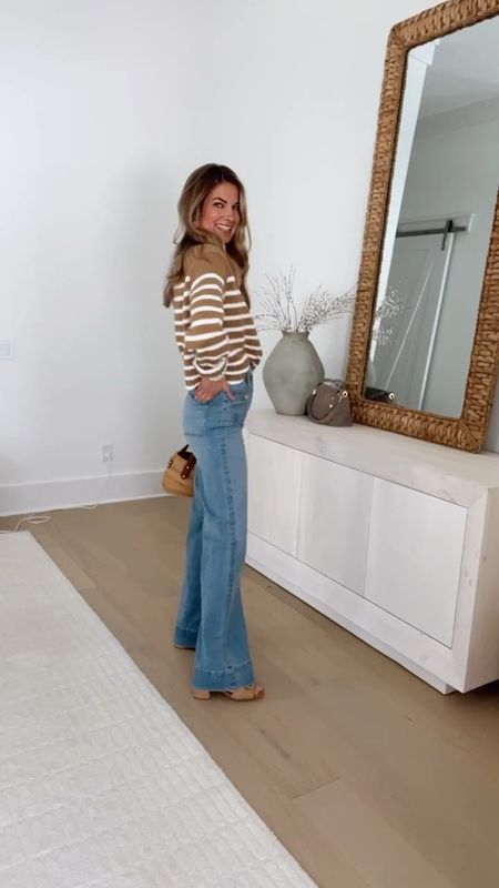 Wide leg trouser jeans! Size down if between - they stretch a bit with wear. I am 5’11” wearing my usual size (26 long) and pair them with a heel.  Small striped sweater. Xs tee. Sandals true to size.  

#LTKsalealert #LTKVideo #LTKover40