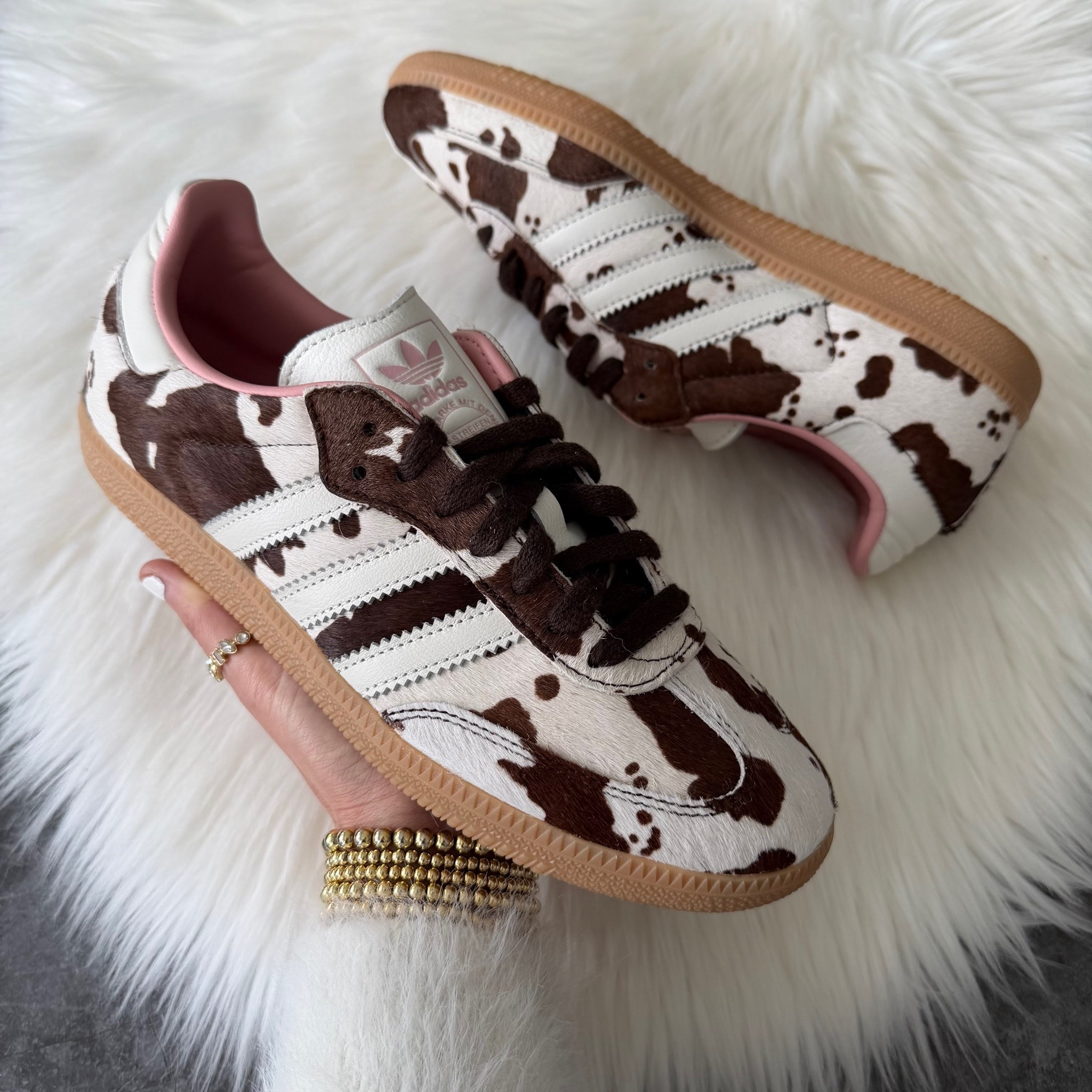 Now 40% off

adidas Samba OG – Cow Print 🐄🤎

These are such a fun twist on the classic Samba! The cow print pony hair paired with the brown details makes them the perfect statement sneaker while still being neutral enough to wear with denim, leggings, or your favorite matching set.

✨ Fit: They run true to size for most people. If you’re between sizes or have wider feet, I’d recommend going up a half size for the most comfortable fit.