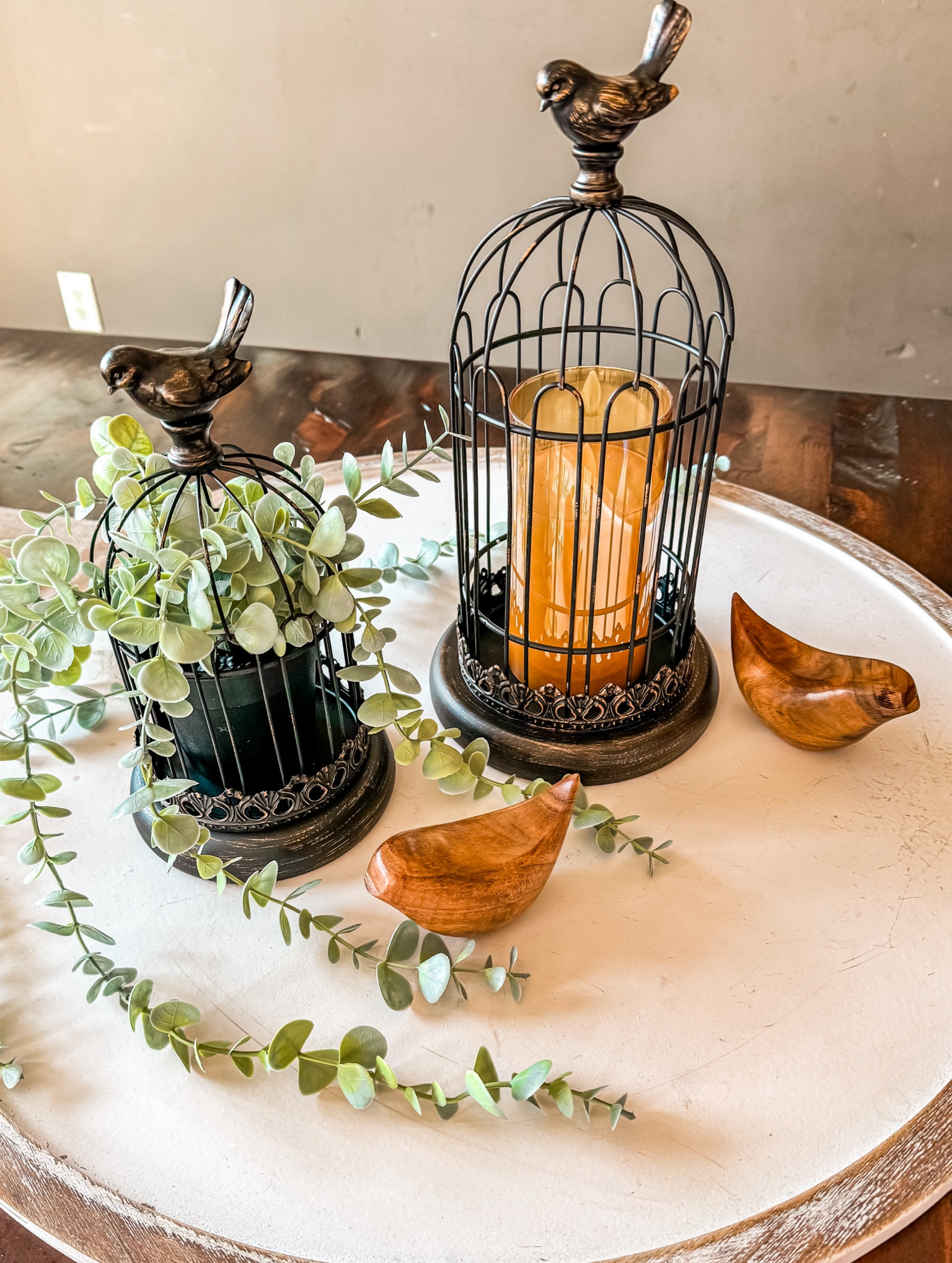 Cute spring centerpiece! Elegant bird cages and little wooden birds.

#LTKhome #LTKSeasonal