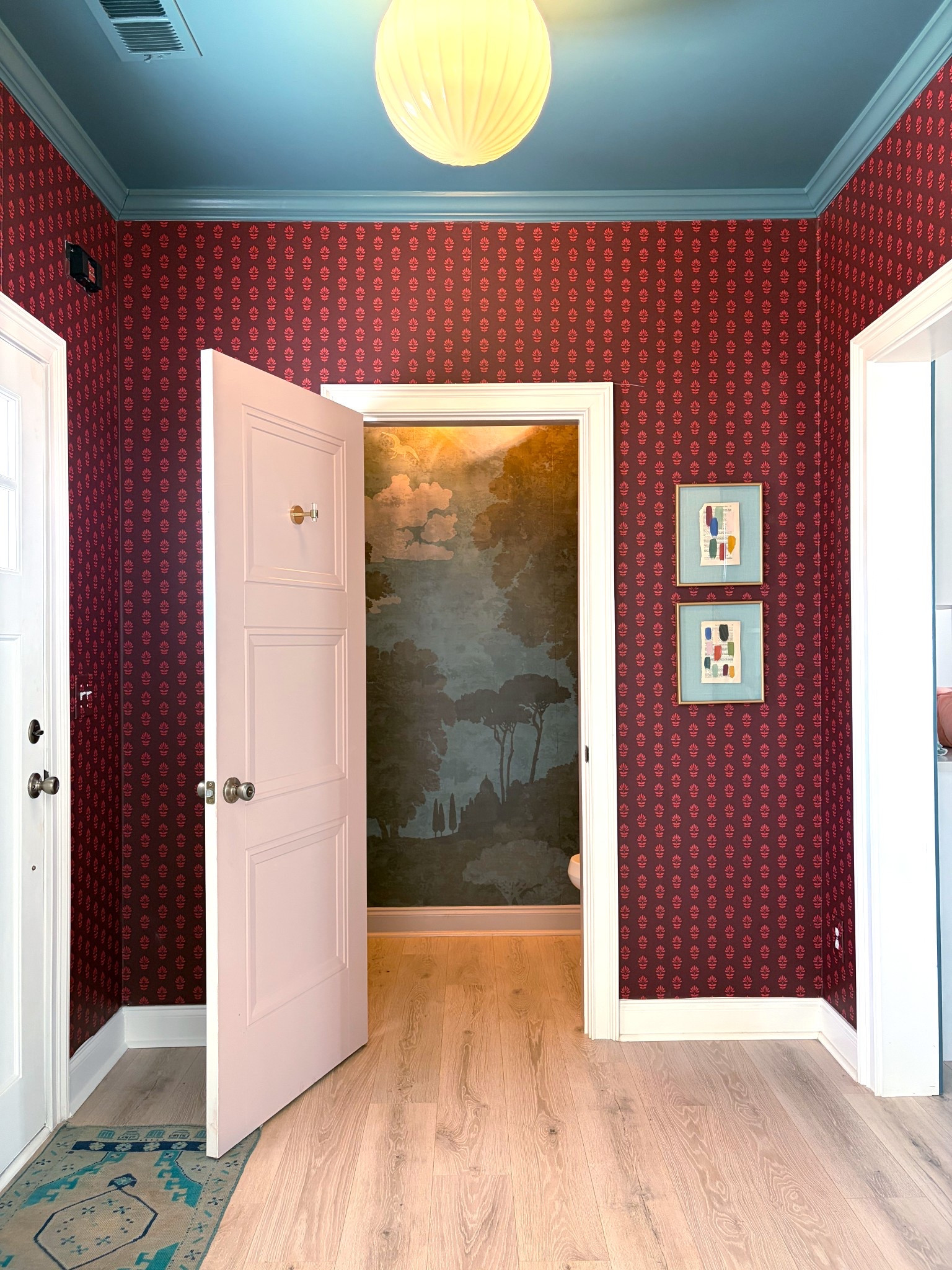 One of my favorite views of the entry and powder room wallpapers — from the dining room where we’re planning to add MORE wallpaper! 