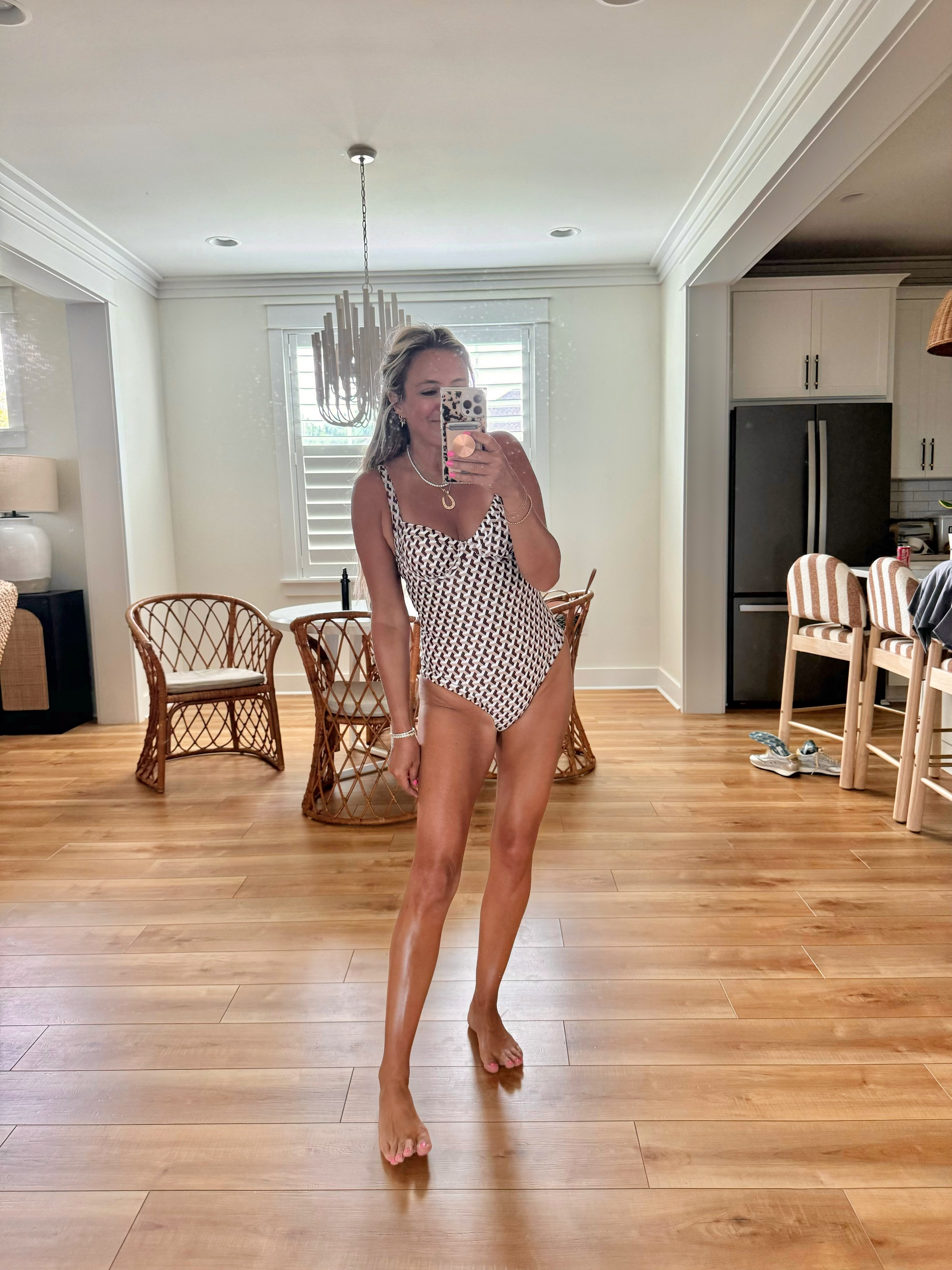 A flattering printed one-piece swimsuit that still feels fun and stylish! I love the neckline, classic pattern, and higher-cut leg. Such a cute option for beach days, pool days, and summer vacations. 

 #LTKfitnessgoals #LTKmomlife #LTKActive