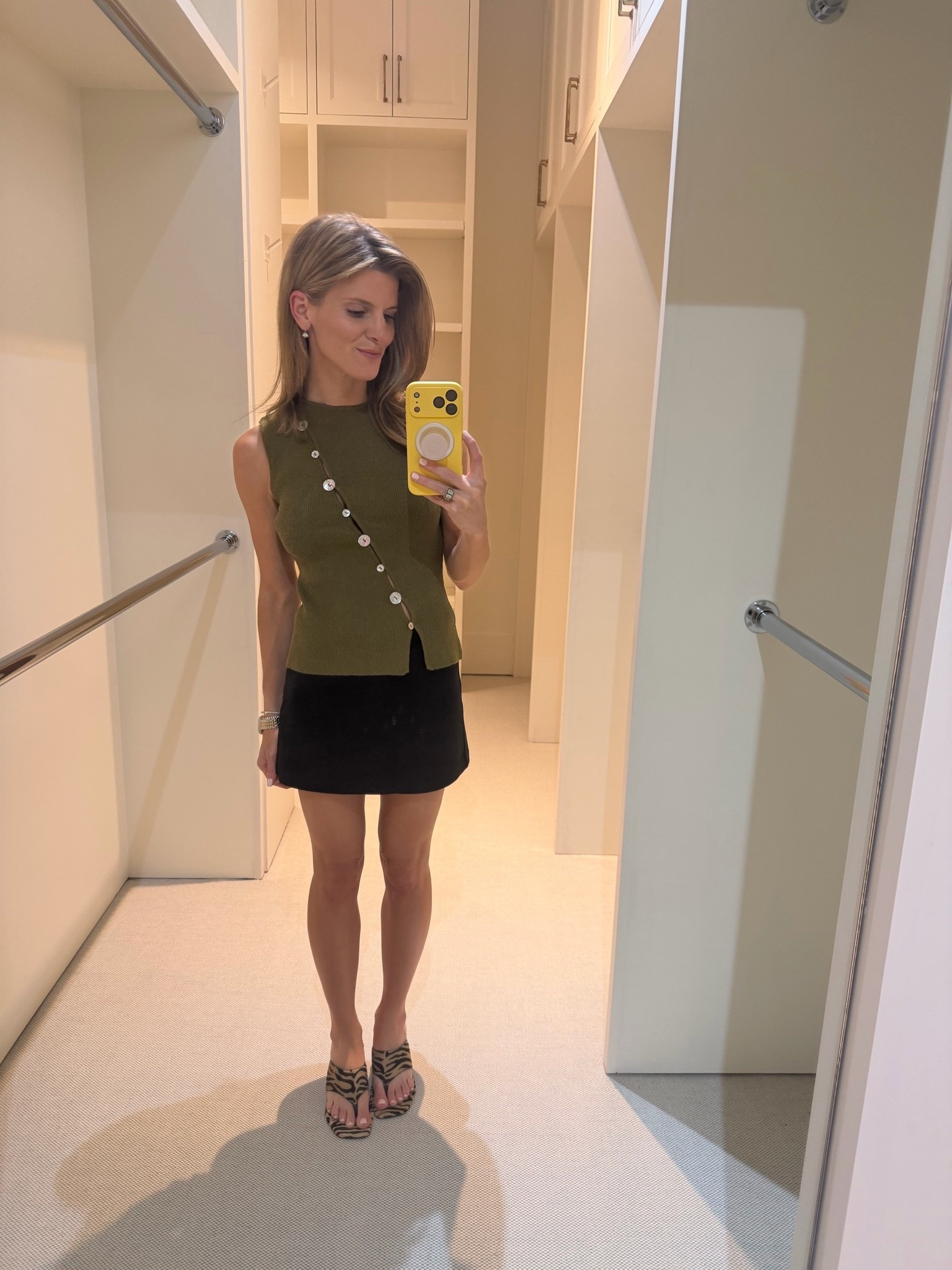 Black miniskirt with Zara asymmetrical button top and reformation kitten zebra heels