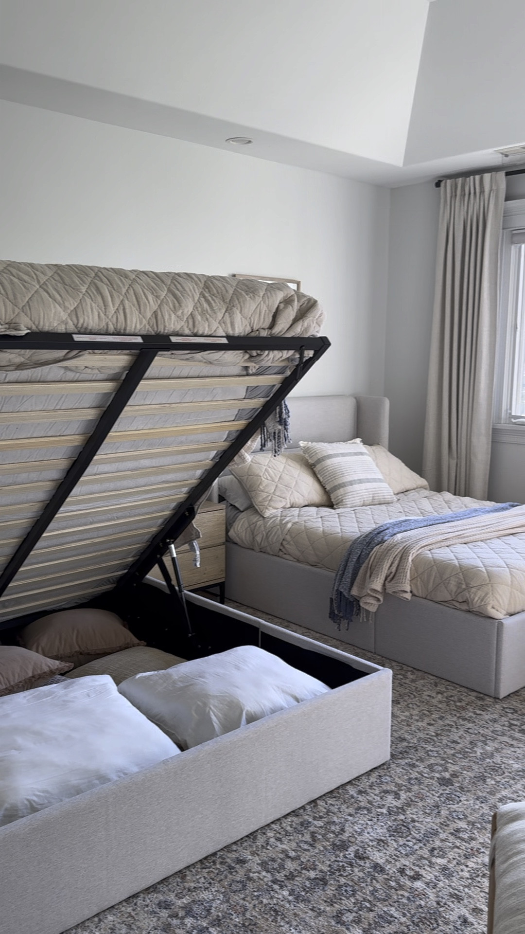 Here is a closer look at the storage beds. They have a lot of storage underneath and it’s easy to lift up. Great for storing things you don’t need now. Also, the material is great, and I love that it’s flush on the floor (no legs).  @wayfair #wayfairfinds #wayfairhome #onlyatwayfair #upholsteredbed 

#LTKHome #LTKVideo #LTKSaleAlert