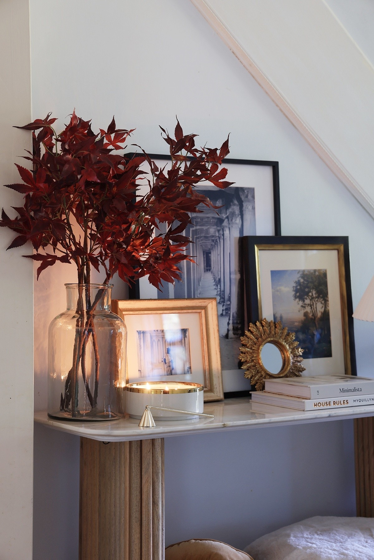 Cozy entryway console table styling | Staggered artwork, small mirror, candles, stack of books, and artificial stems for fall

#LTKSeasonal #LTKHome