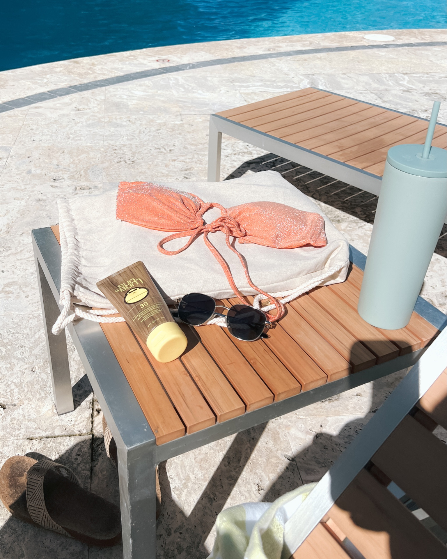 Sunny day pool side essentials 
• Monday swim bikini 
• Sunbum sunscreen 
• Dime optics sunglasses
• Simple modern emotional support water bottle 