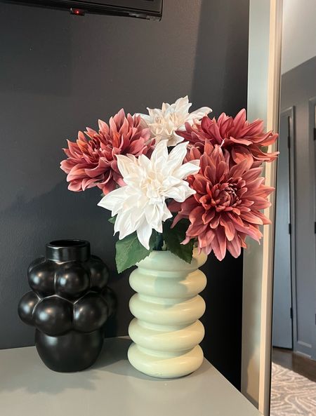 Couldn't sustain the upkeep of real flowers so I refreshed this vase with these artificial dahlia stems, and I couldn't be more obsessed! They look and feel real! 

Vase, faux flowers, fake flowers, white flowers, pink stems

#LTKsalealert #LTKFind #LTKhome