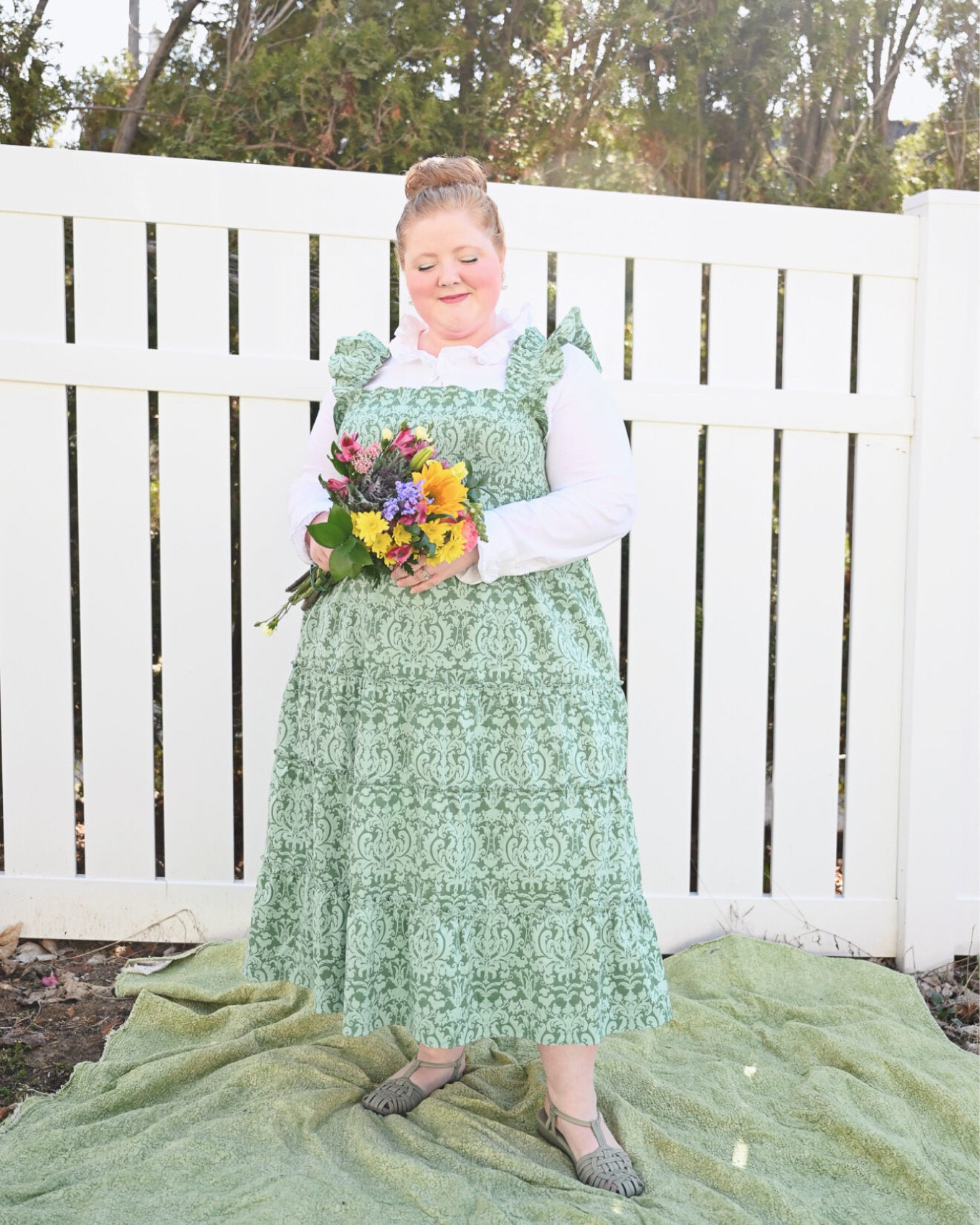 The Hill House Nap Dress is one of the most coveted and collected dress styles among fashion girlies today. The key to their popularity? Their ease of wear. So comfortable you could sleep in them, as the name suggests. In this post, I’m sharing my Hill House Nap Dress Plus Size Review. Hill House now offers several iterations of the Nap Dress, from sleeveless midi styles to short-sleeve mini dresses. All Nap Dresses feature a stretch smocked bodice and fit-and-flare silhouette and come in fabrics ranging from cotton and wrinkle-resistant crepe for everyday to velvet and brocade for the holidays. And while the Nap Dress is what Hill House is perhaps best known for, they carry a full range of dresses and apparel in sizes xxs-XXL.

The Ellie with its ruffled shoulders is perhaps the most iconic of the Hill House Nap Dresses. It wears beautifully on its own, but you’ll also see it styled over turtlenecks and crisp collared shirts. My measurements are 47-39-51, and I fit firmly in the size XXL at Hill House according to their size chart, but I sized down to the XL based on reviews. Since the Nap Dress is stretchy up top and free through the hips, the general guidance around Hill House sizing is to size down.

I layered my Hill House Ellie Nap Dress over this Ruffle Collar Button Front Blouse from Ulla Popken. You can save 25% on your Ulla purchase with code 2023LIZ25. Between the frilly collar and ruffled shoulders, I chose a dainty drop earring. Pearls are a perfect pairing for a Hill House Nap Dress because they’re classic, preppy, and prim.

This Petite Golden Flower + Pearl Drop earring is from Nicola Bathie Jewelry. This jewelry brand – specializing in chic and romantic statement jewelry – is a great one to pair with your Hill House Nap Dress. My shoe is the Impo Rivka Wedge Sandal from DSW, and it’s priced at $54.99. The straps are elasticized for a stretchy, flexible, and supportive fit. The sole is cushioned for comfortable wear. These come in 4 colorways including this sage green, black, white, and cognac.


#LTKSeasonal #LTKcurves #LTKwedding
