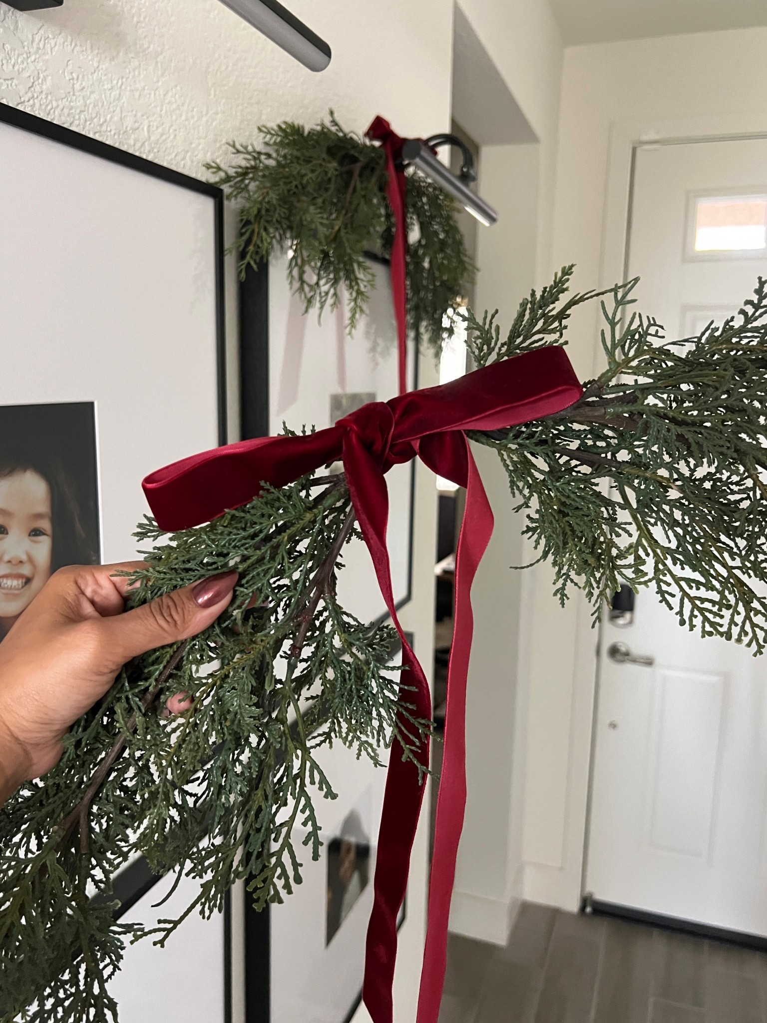 I created this swag using 2 25”’cedar faux stems and using a zip tie to hold them together. Finished them off with some velvet ribbon 🌿✨

#LTKHoliday