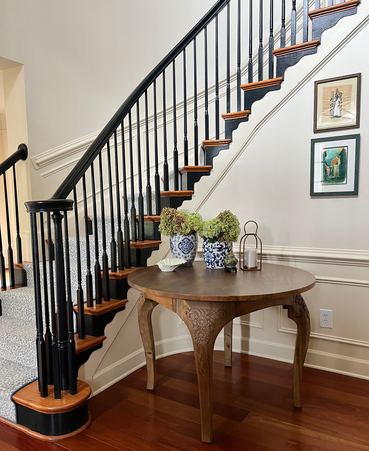 Entry way table and decor. Black stairs and animal print. Fall vibes. Wooden round table. Dining table  

#LTKSeasonal #LTKhome #LTKstyletip
