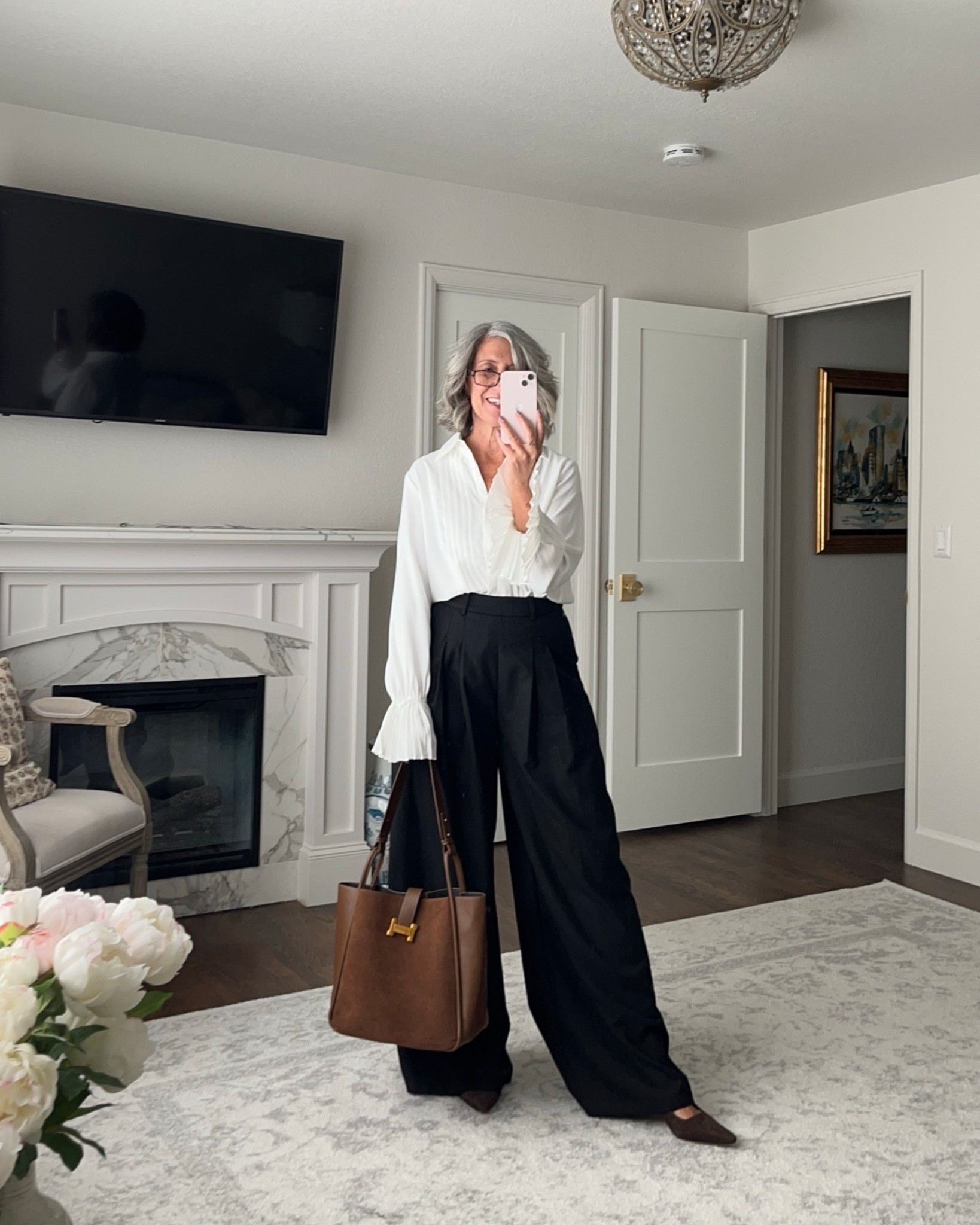 What if the most powerful thing you could wear was also the simplest? 

It's a challenge we often face wanting to make a strong impression without an overly complicated outfit. This classic black and white look is the perfect solution. The clean, crisp lines of the white pleated top combined with the sleek, black wide-leg trousers create a silhouette that is both effortless and authoritative.

This is the outfit you wear when you need to be decisive and command respect—for a new client meeting or a team briefing. It’s an outfit that says you are a director, someone who is a leader and makes a clear, impactful statement with confidence. 

Use Code: emptyneststyle_12 for 12% off

I am typically a medium, and I find that these pieces all fit true to size.

Ready to feel authoritative and confident? 
Shop the look by tapping the links below.

     

white shirt black pants, high-contrast outfit, business professional, classic workwear 

 

#LTKSeasonal #LTKOver40 #LTKWorkwear