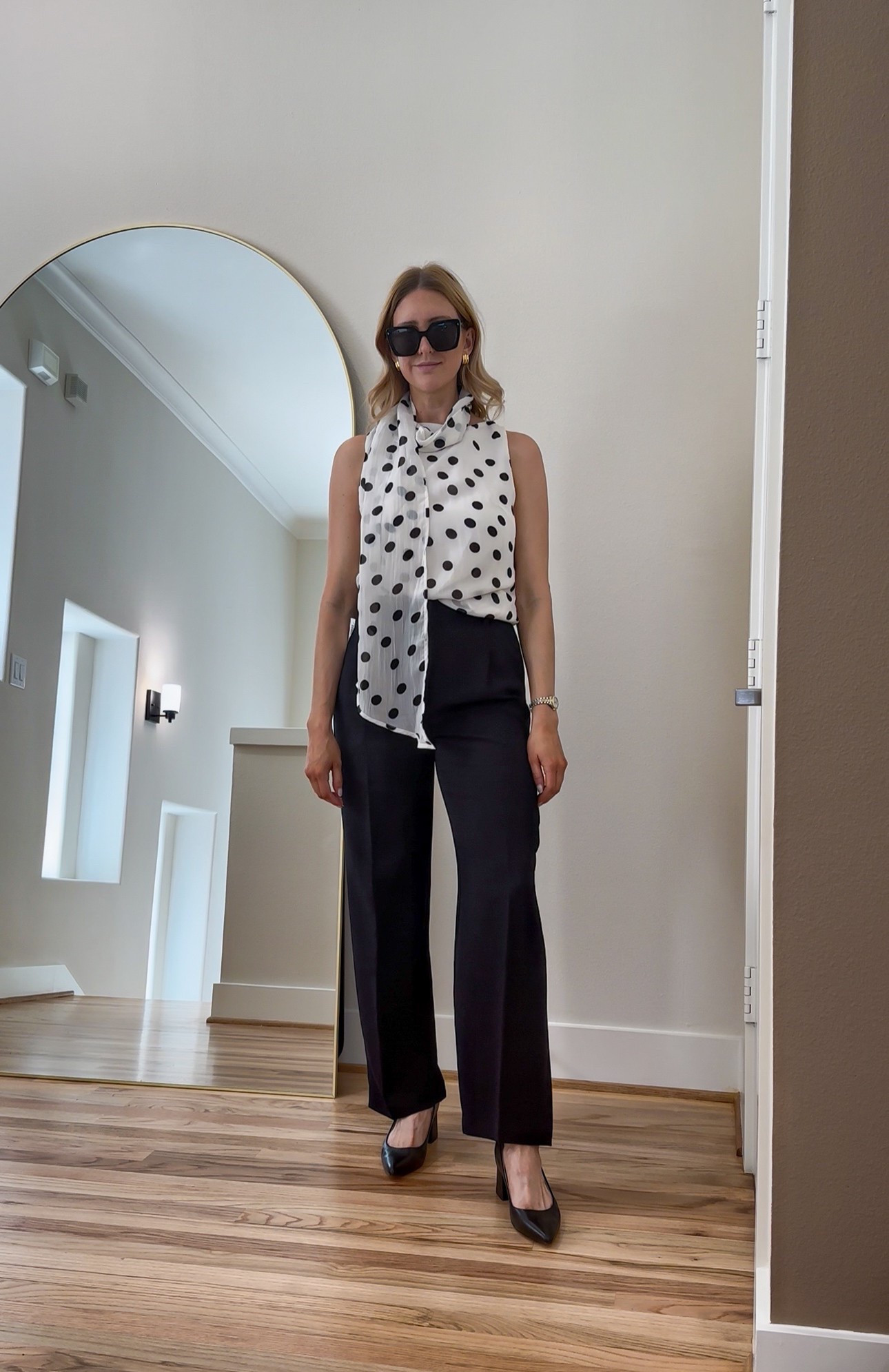 Polka dots & power pants – the perfect combo for work-to-weekend style!
This sleeveless blouse with a scarf tie detail adds a fun, feminine twist to classic black trousers. Whether you're heading to the office or out for drinks, this look is polished, chic, and effortless.

Shop the look:
#WorkwearStyle #OfficeOutfit #PolkaDotTop #BlackTrousers #BusinessCasual #ChicStyle

#LTKStyleTip #LTKFindsUnder100 #LTKWorkwear