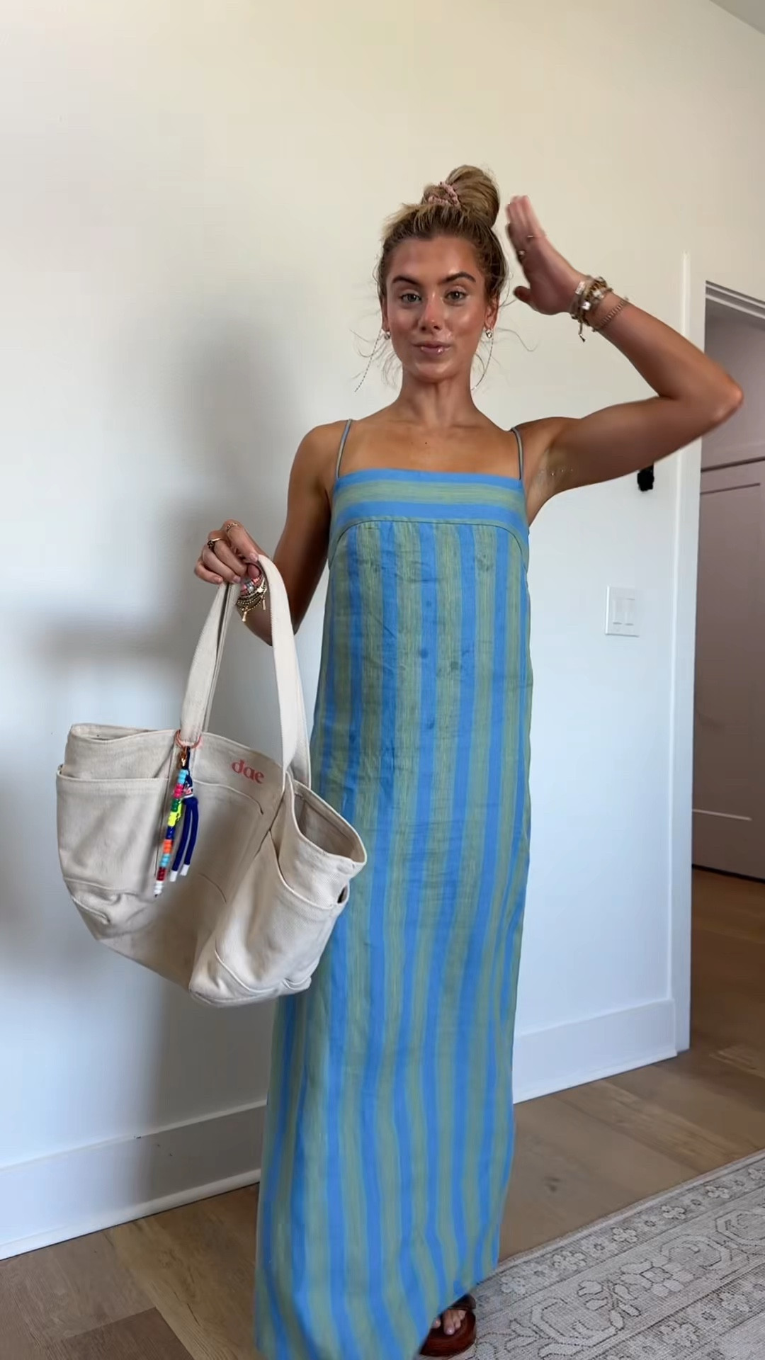 My dress is from @staud it’s the Laura striped linen maxi dress size xs. I got mine from @renttherunway  my code is RTRXSVOSEN50. I paired it with my new amazon sandals

#LTKootd #LTKSaleAlert #LTKdayinmylife