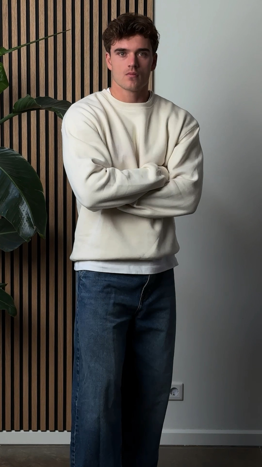 Wearing size XL on the sweater and grey joggers 
