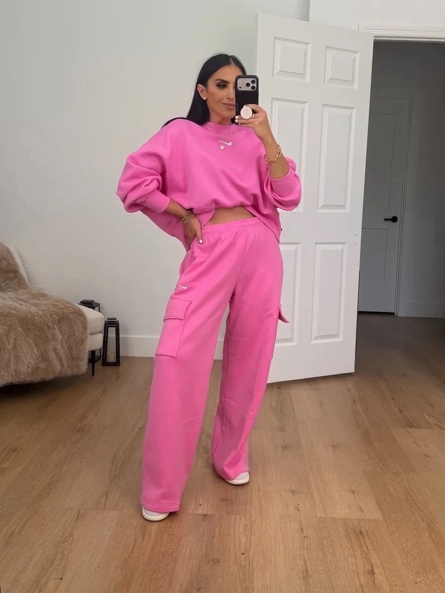 Woman’s Nike Sportswear Phoenix Fleece Over-Oversized Crew-Neck Sweatshirt now $39. I’m wearing a size small. Woman’s Nike Sportswear Phoenix Fleece cargo pants. I’m wearing a size medium.

