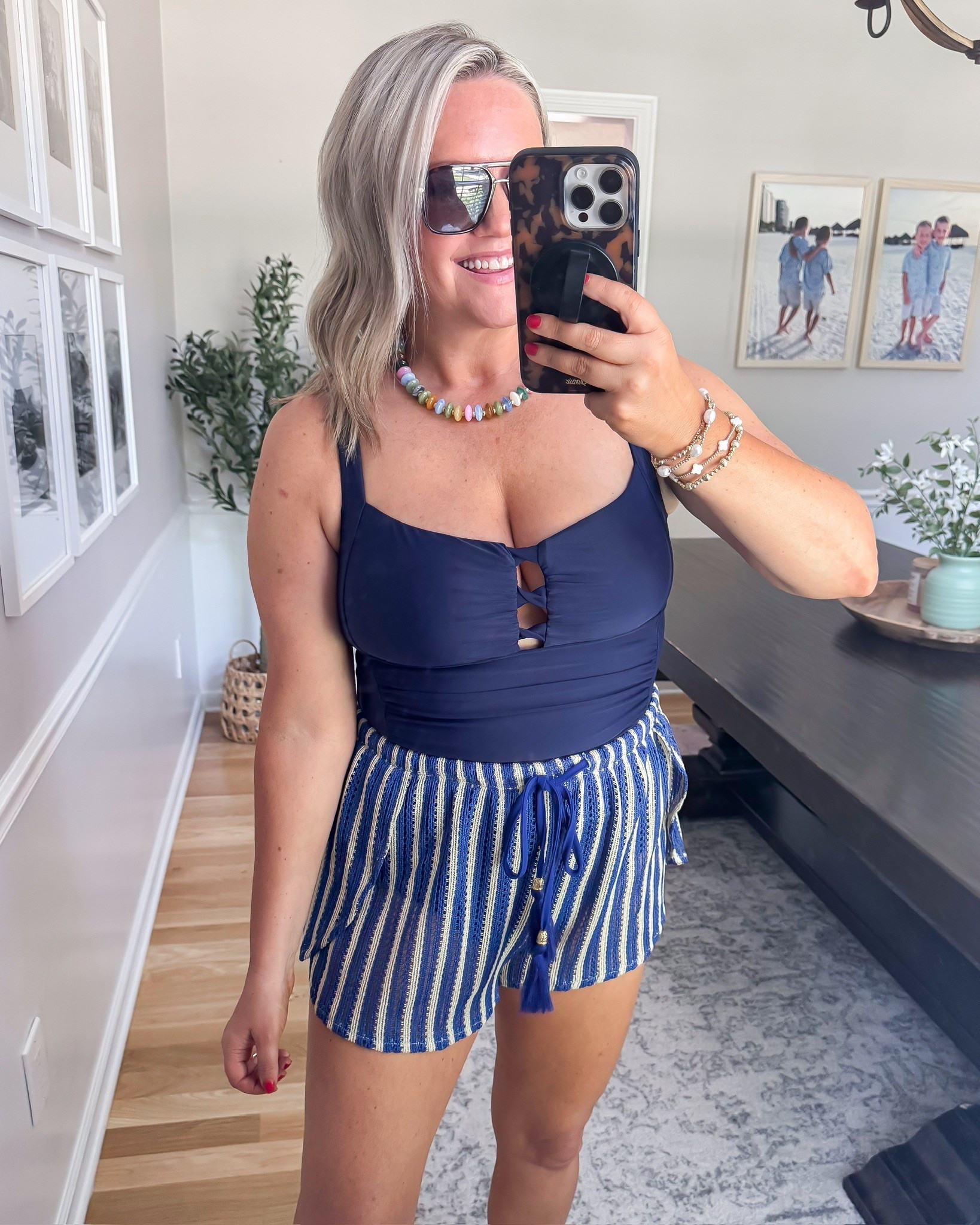 This navy swimsuit and shorts combo is so flattering. The shorts add a fun coastal feel with the tassel tie detail. Perfect for vacation!

Navy swimsuit, striped shorts, summer outfit, vacation outfit, coastal style, beach vacation look, resort wear, casual chic outfit, summer fashion, tassel shorts, vacation style, lovelylifestyling

#LTKOver40 #LTKTravel #LTKSwim