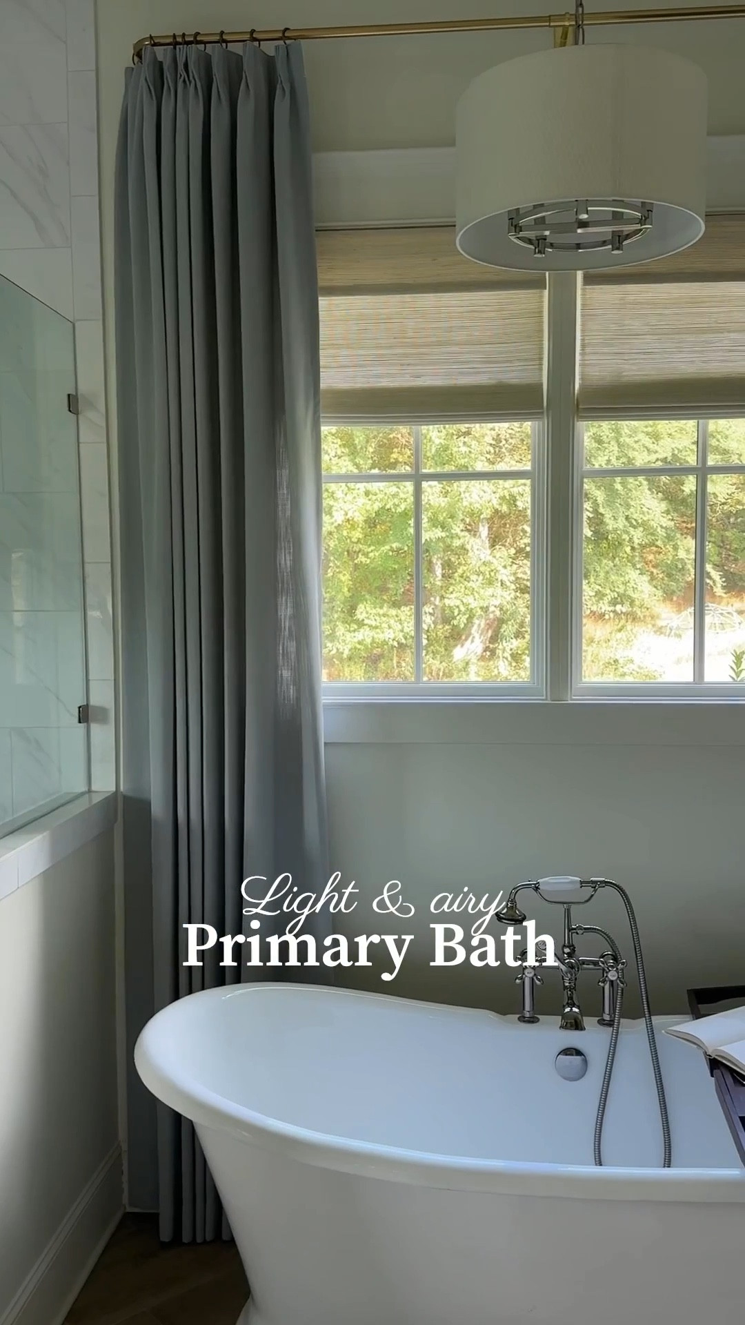 We recently added curtains to our primary bathroom, and I can’t believe the difference they made. I’ve always loved how light and airy this space feels, but it was missing that finishing touch. The soft blue curtains added just the right amount of color and brought a cozy softness to balance the hard surfaces. I love the timeless look of this bathroom, and now it feels complete. ✨

Curtain & woven shade details: -Isabella cotton curtains in color Winter Sky, triple pleat, privacy lined, & memory trained. 
-woven shades: natural bamboo shades in color wall white-motorized. 

Use code RachelHome20 for 20% off your TwoPages order on their website  
